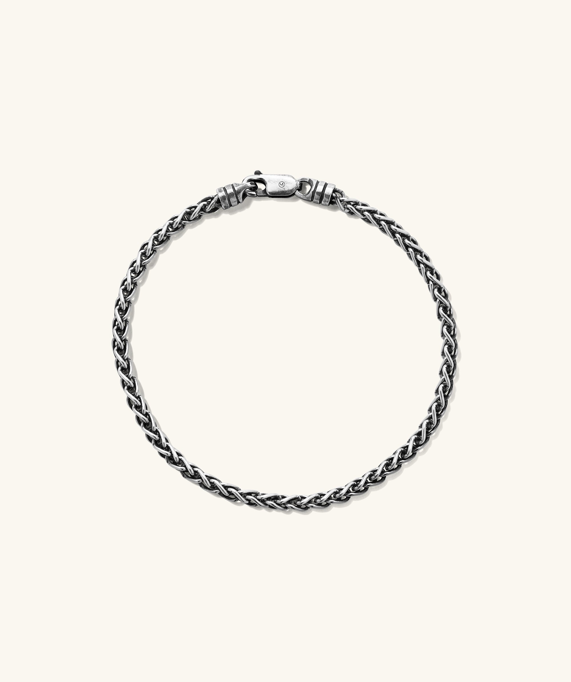Silver 3.3mm Wheat Chain Bracelet with clasp, intricately woven and handcrafted in oxidized sterling silver for a lived-in look.