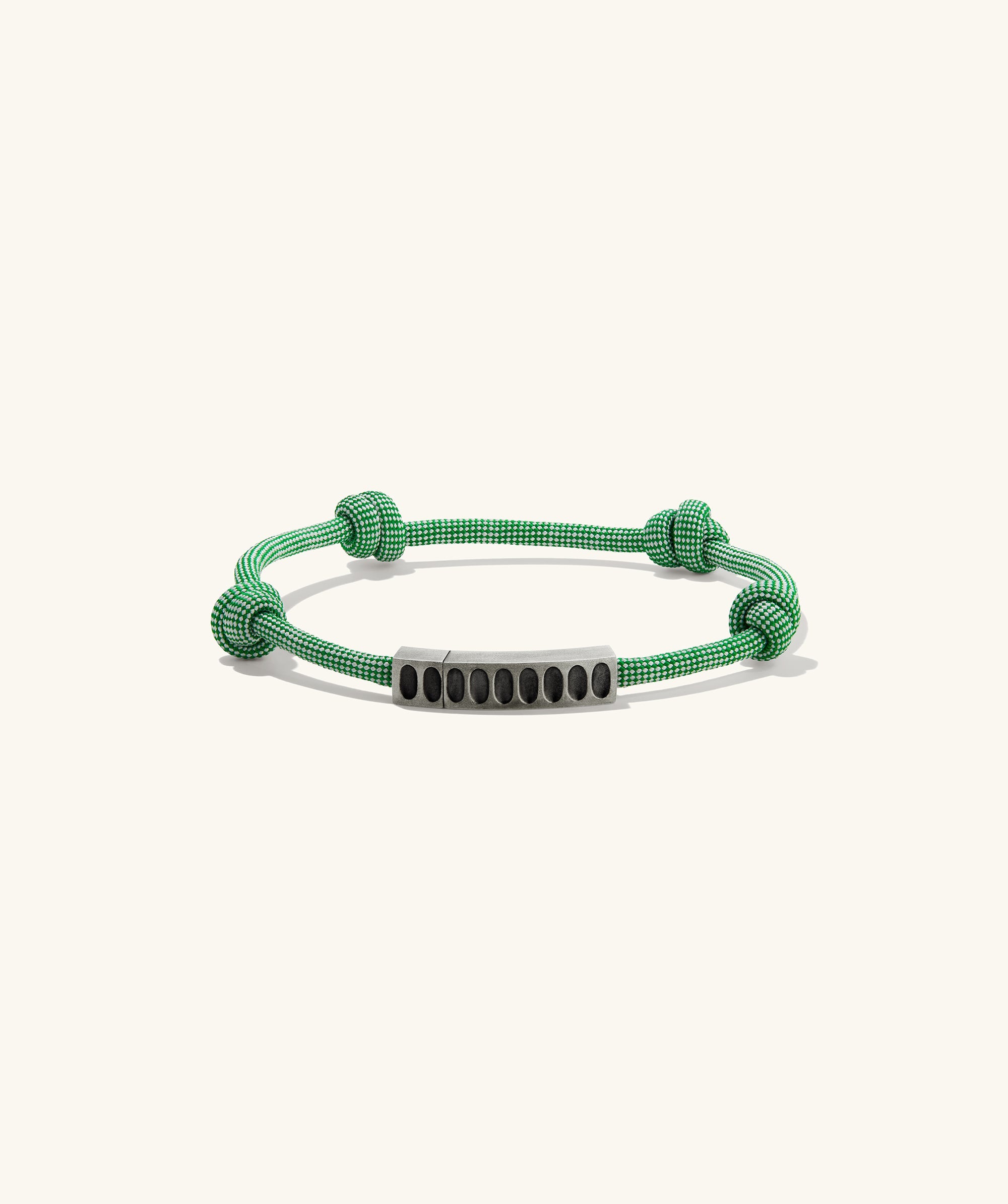 Colosseum Cord Bracelet featuring a striking metal and cord design, inspired by the Charlotte collection, ideal for adventurous outings.