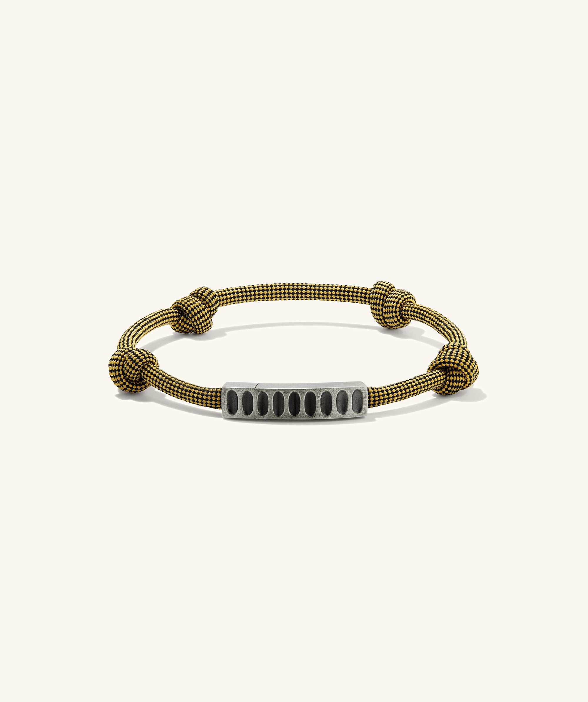 Colosseum Cord Bracelet featuring a bold metal and cord design, inspired by the Charlotte collection, perfect for adventurous outings.