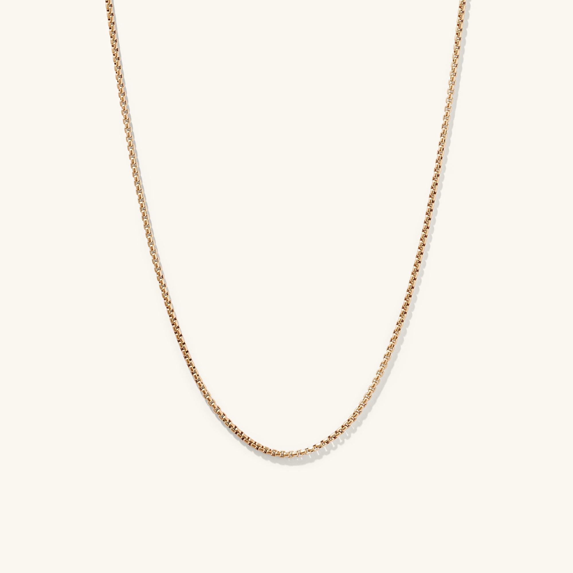 Round Box Chain Necklace featuring a sleek gold chain with a small diamond pendant, perfect for everyday wear and pairing with matching bracelet.