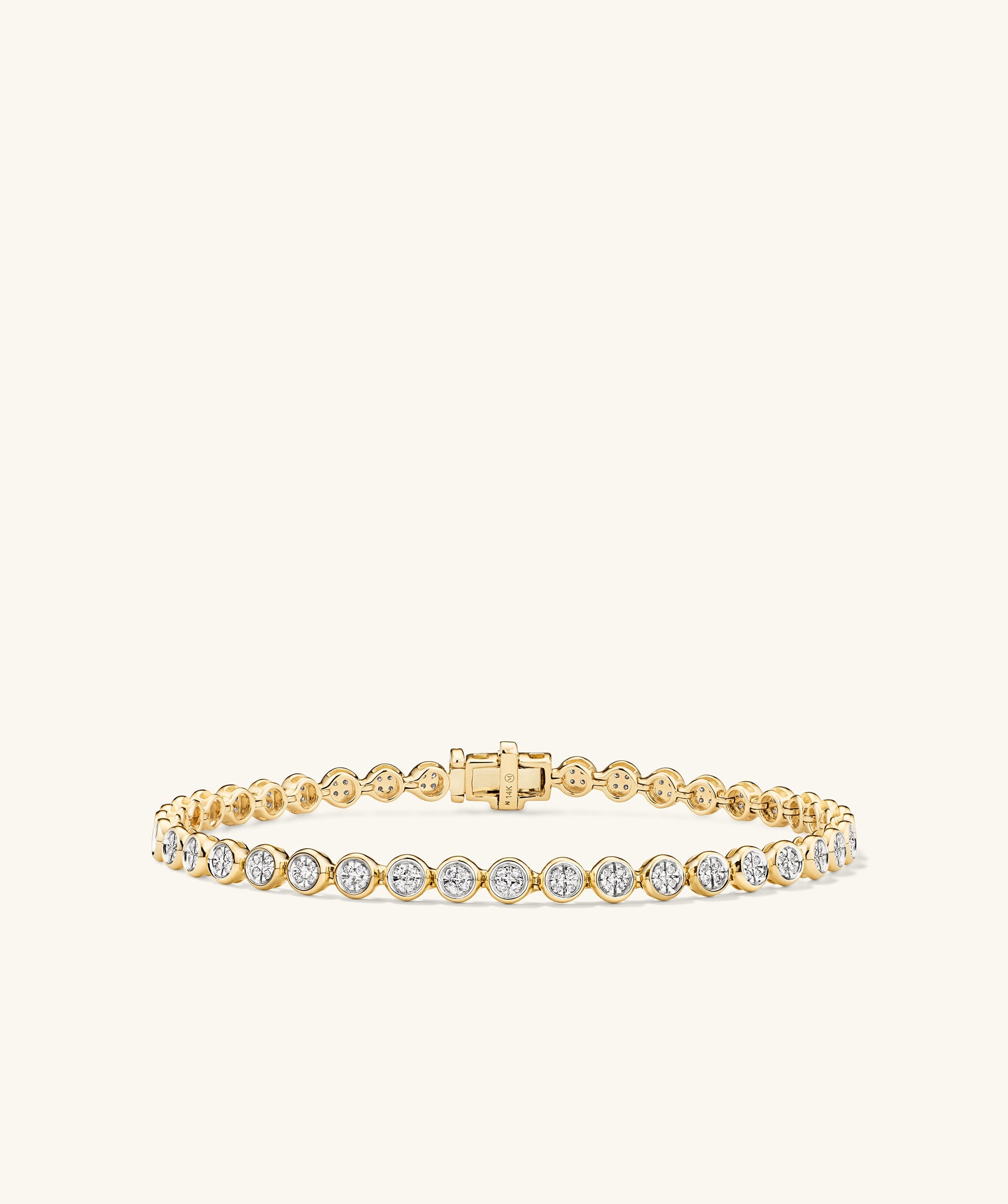 Micro-PavÃ© Diamond RiviÃ¨re Bracelet in 14k gold, featuring 176 hand-set diamonds in knife edge bezel setting, showcasing a continuous stream of sparkle.