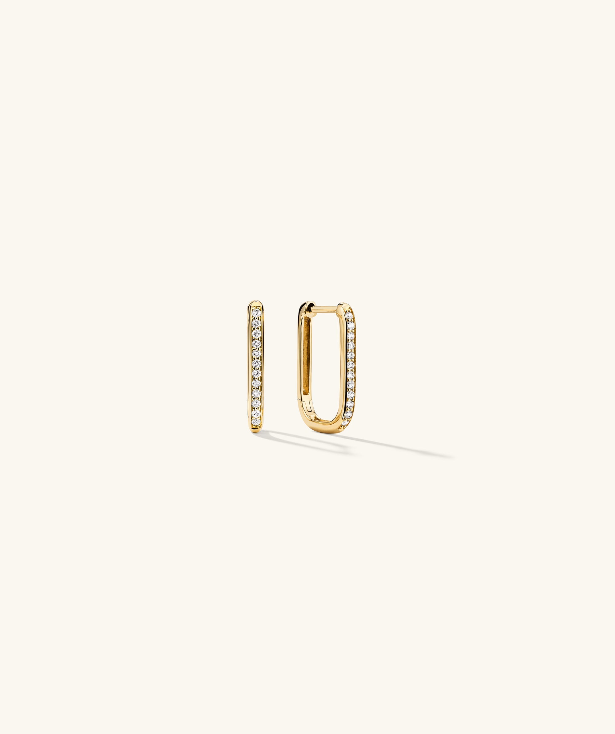PavÃ© Diamond Small U Hoops: 14k gold U-shaped earrings adorned with responsibly sourced diamonds, adding dimension and sparkle to your ear stack.