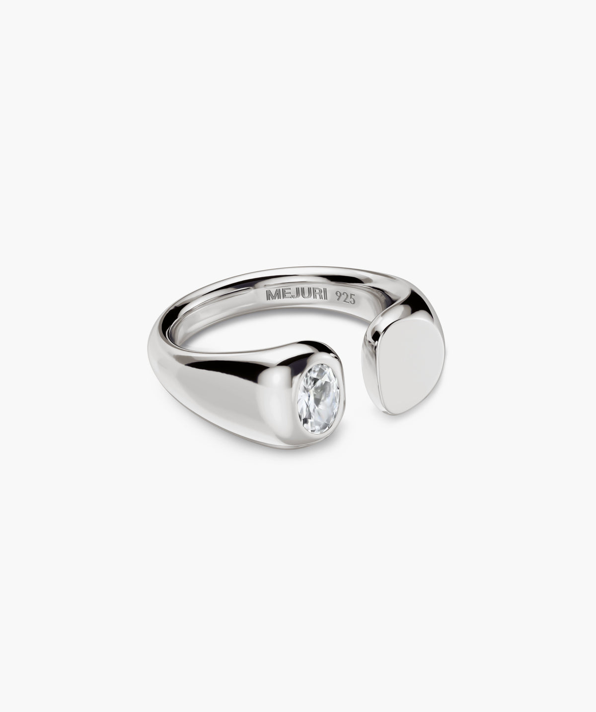 Noa Open Signet Pinky Ring features a sterling-silver open band with a clear stone on one end and a polished metal pad on the other.