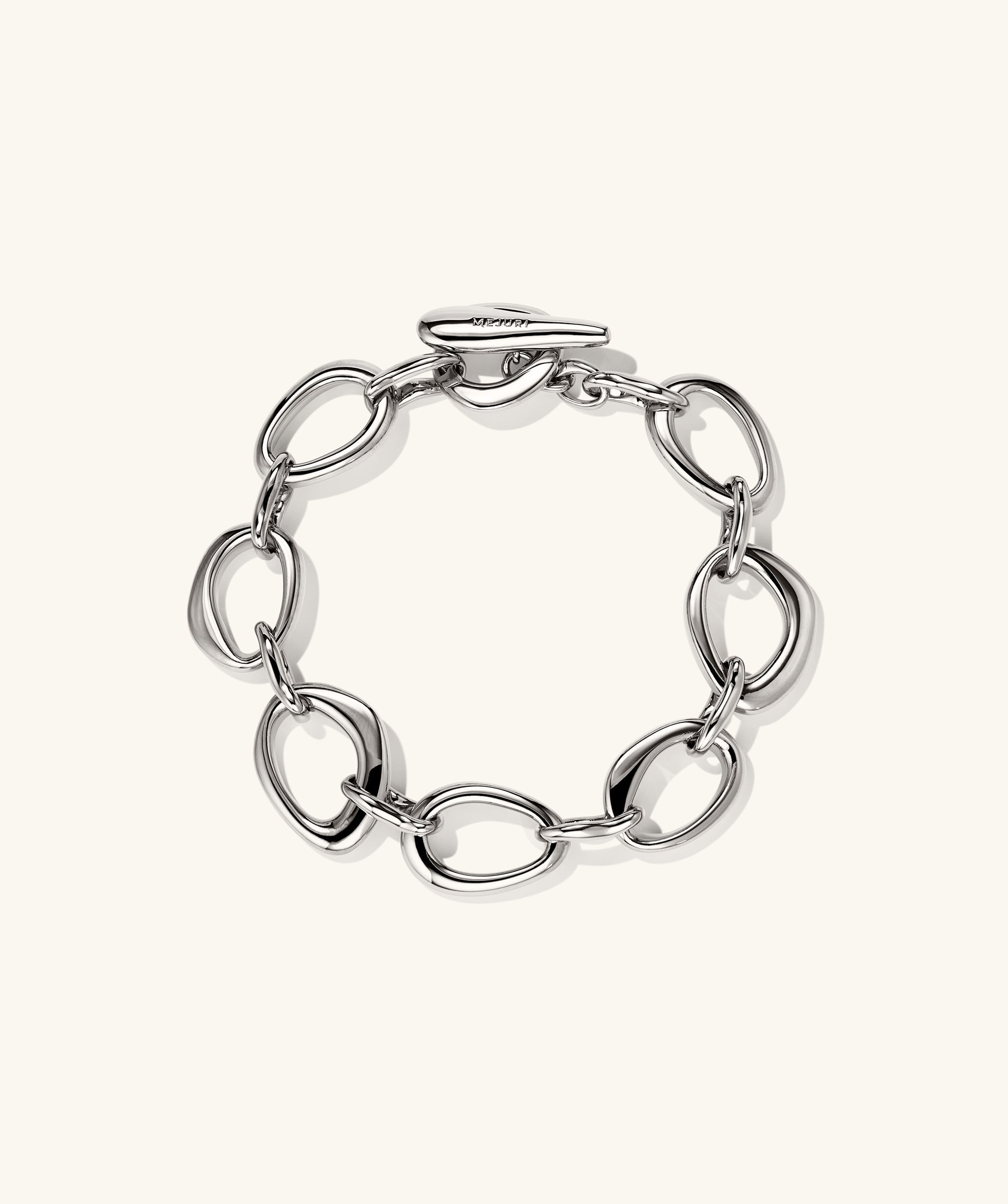 Organic DÃ´me Ripple Chain Bracelet featuring interlinked open shapes and a toggle clasp, showcasing an elegant, wearable design.