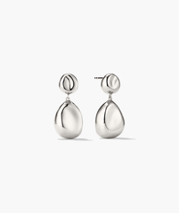 Organic DÃ´me Pebble Earrings featuring a pair of elegant, silver drop earrings with a refined, natural design, perfect for versatile fashion statements.