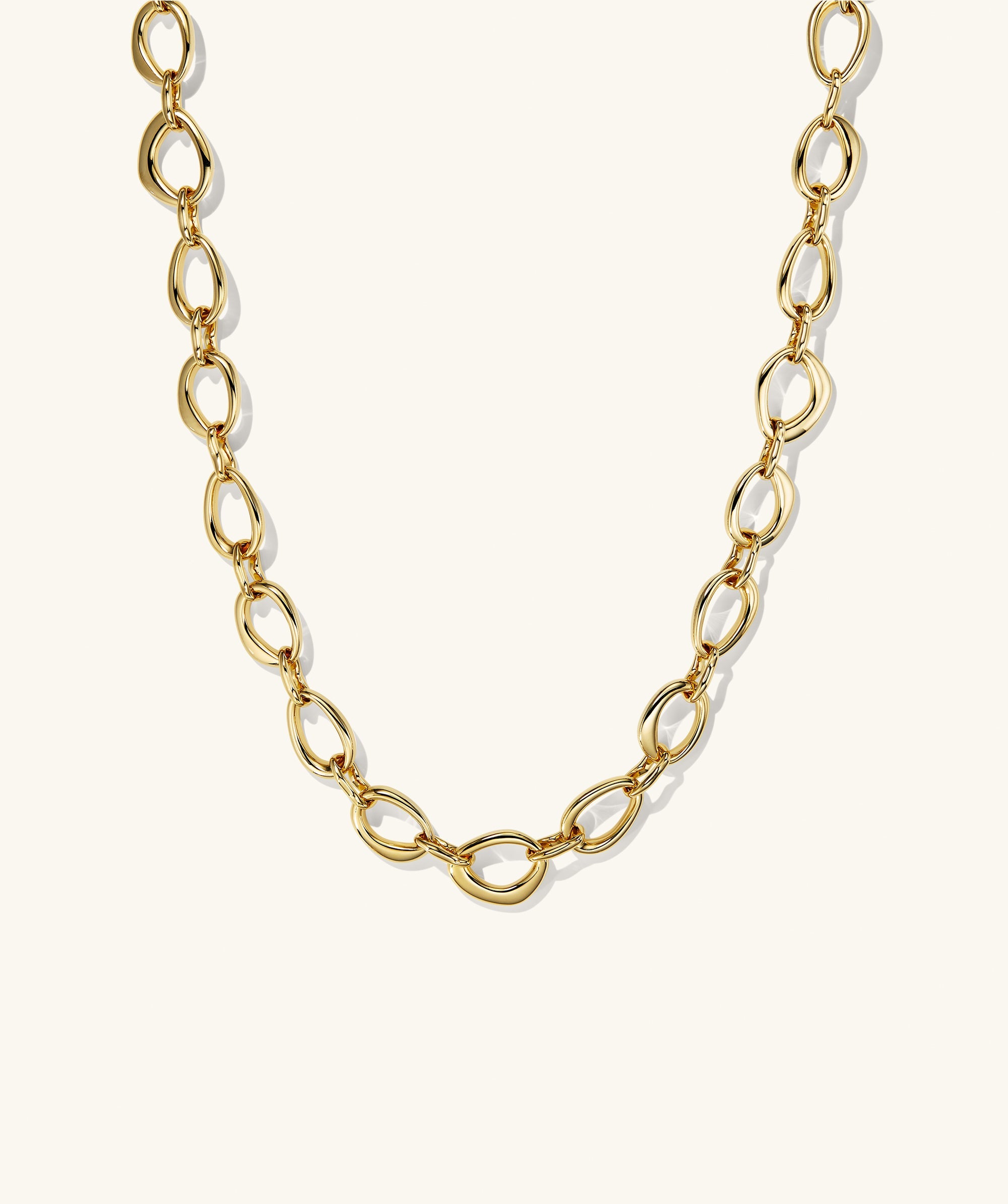 Organic DÃ´me Ripple Chain Necklace featuring organic, irregular oval links with a toggle clasp, showcasing a fluid design that enhances any outfit.