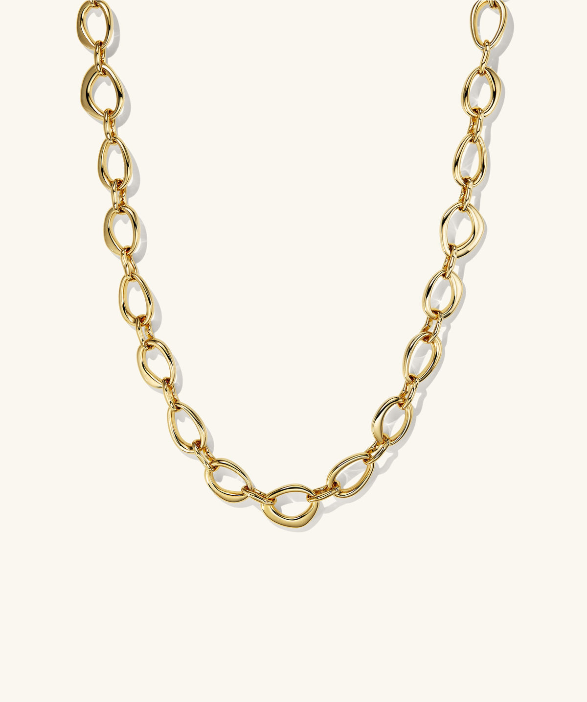 Organic DÃ´me Ripple Chain Necklace featuring organic, irregular oval links with a toggle clasp, showcasing a fluid design that enhances any outfit.