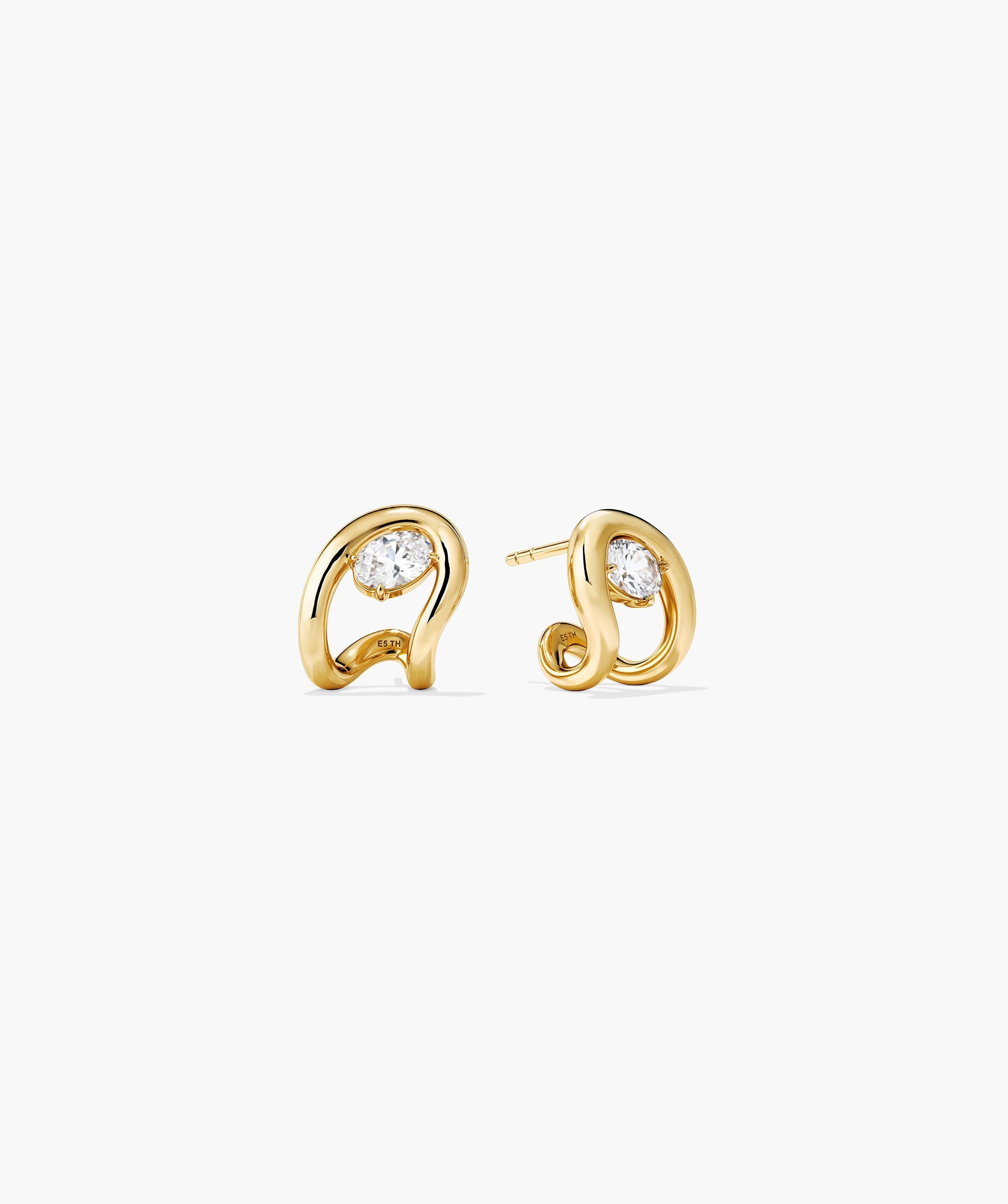 Organic DÃ´me Curve Gemstone Huggies feature polished gold knot studs cradling a central round gemstone, shown in front-on and side views.