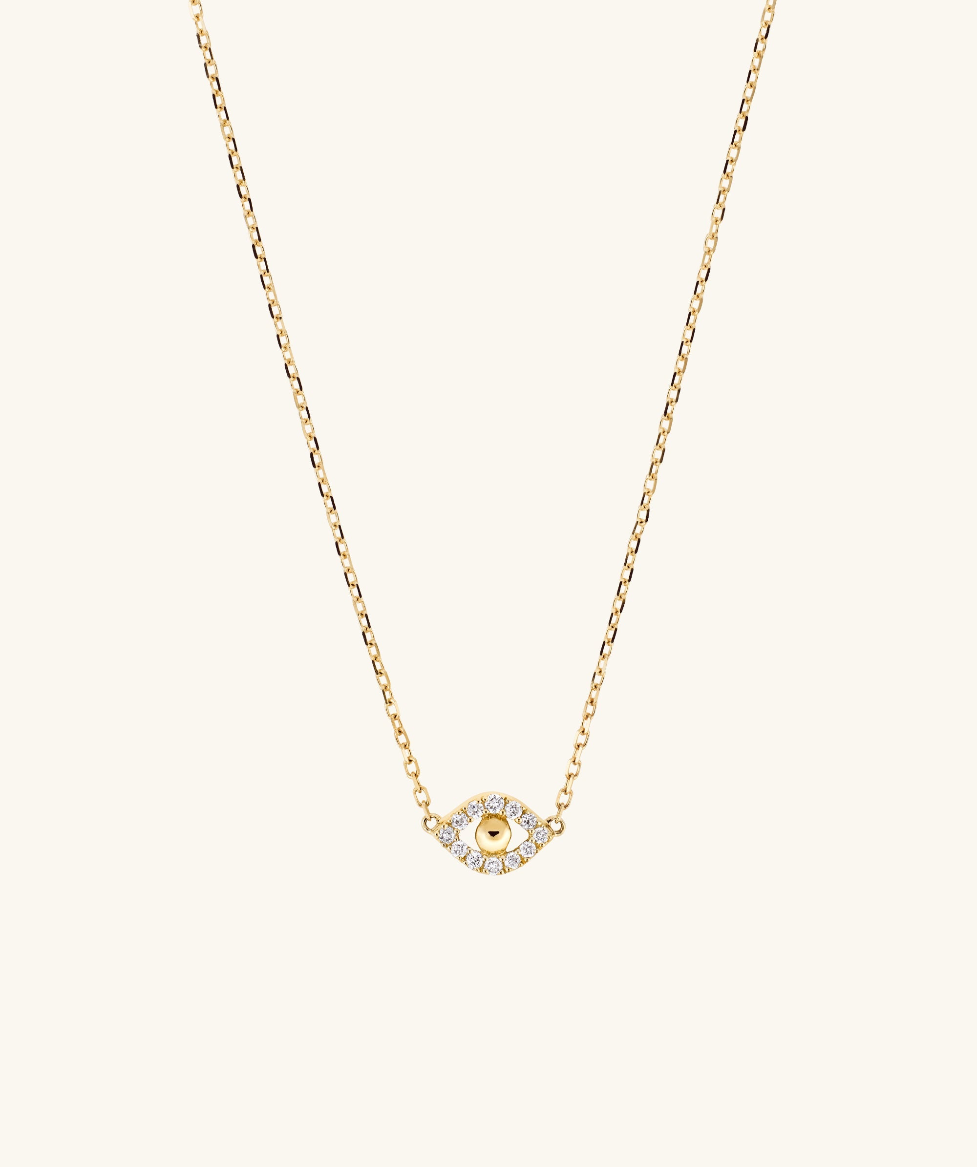 PavÃ© Diamond Evil Eye Necklace featuring a delicate gold chain with a small eye pendant, designed to ward off envy and negative energy.