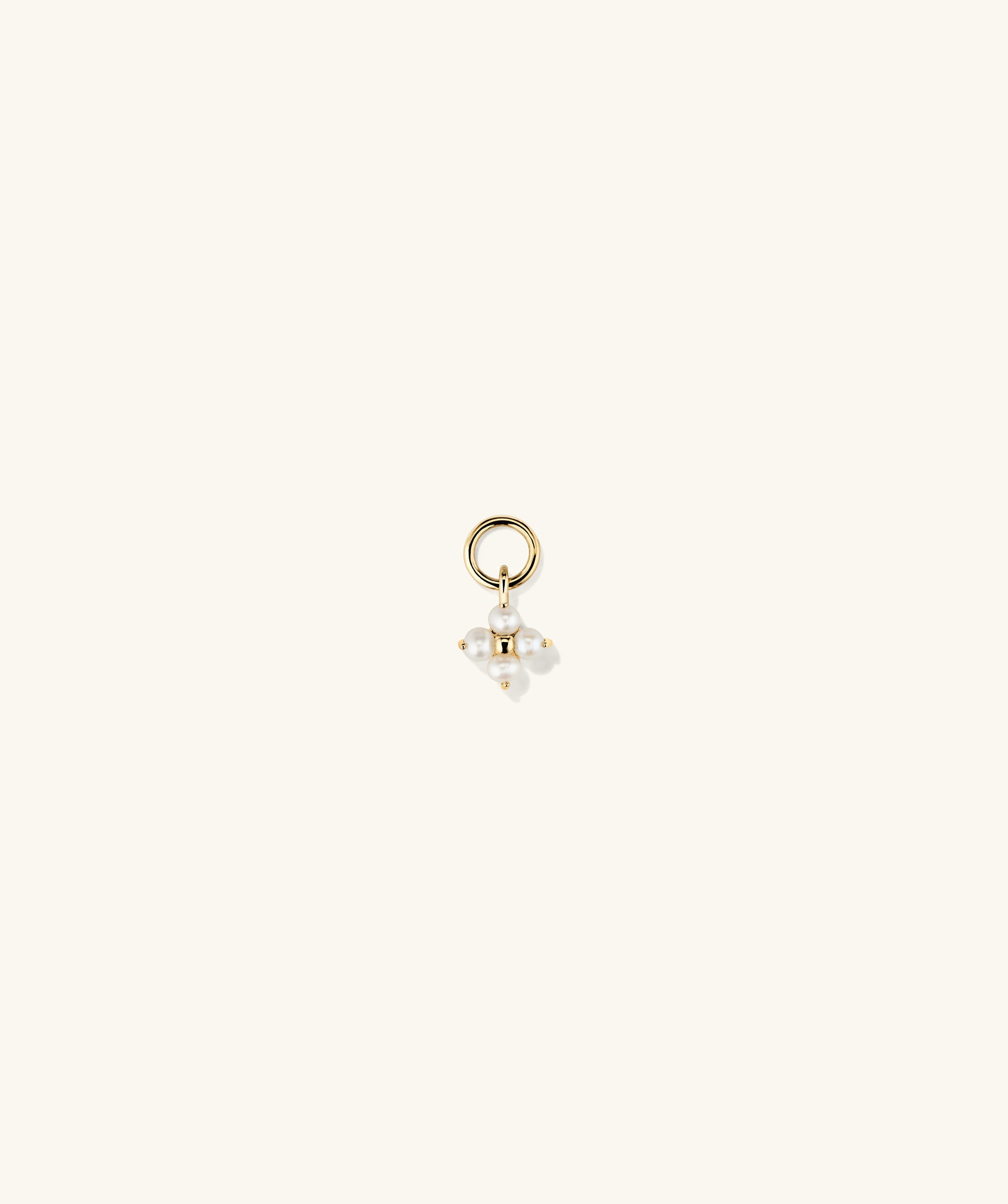 Cluster Pearl Hoop Charm featuring handcrafted 14k gold with a cluster of freshwater pearls, shown in a close-up view.