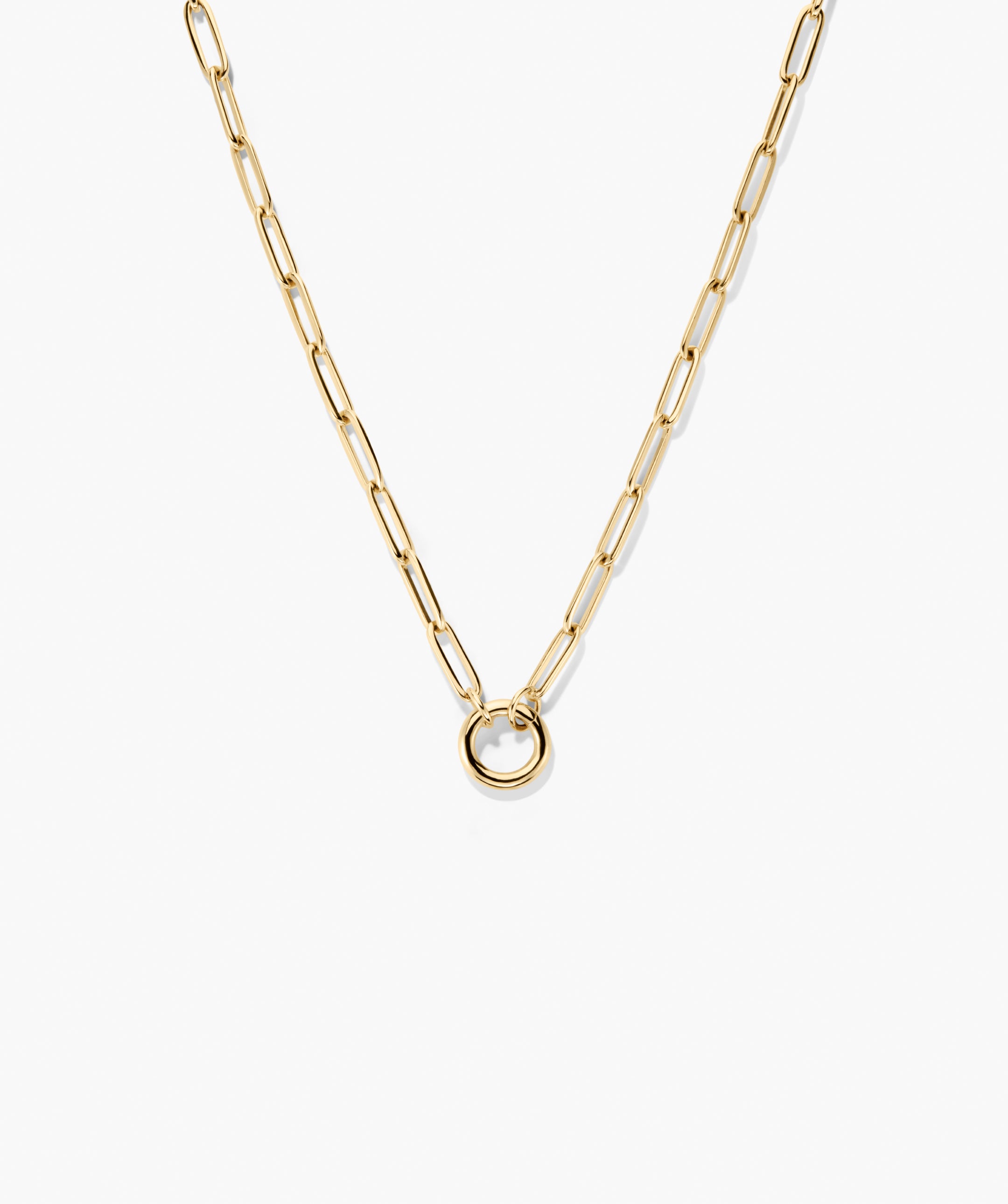 Paperclip Chain Charm Necklace with polished elongated links and a circular ring pendant, designed for layering charms, wearable stacked or spaced.