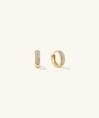 Bold PavÃ© Diamond Huggie Hoops: A pair of 14k gold hoop earrings adorned with responsibly sourced diamonds, handcrafted for an elegant, eye-catching look.