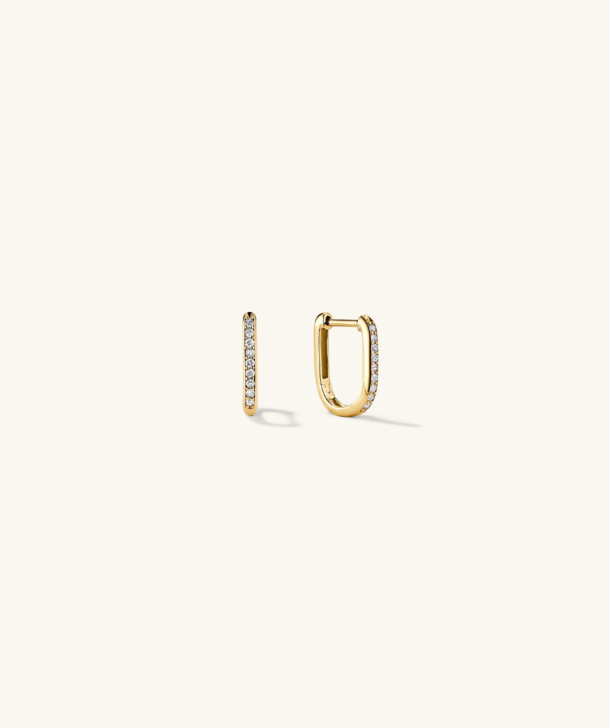PavÃ© Diamond Huggie U Hoops: A pair of handcrafted 14k gold square hoops adorned with diamonds, perfect for adding elegance to your ear stack.