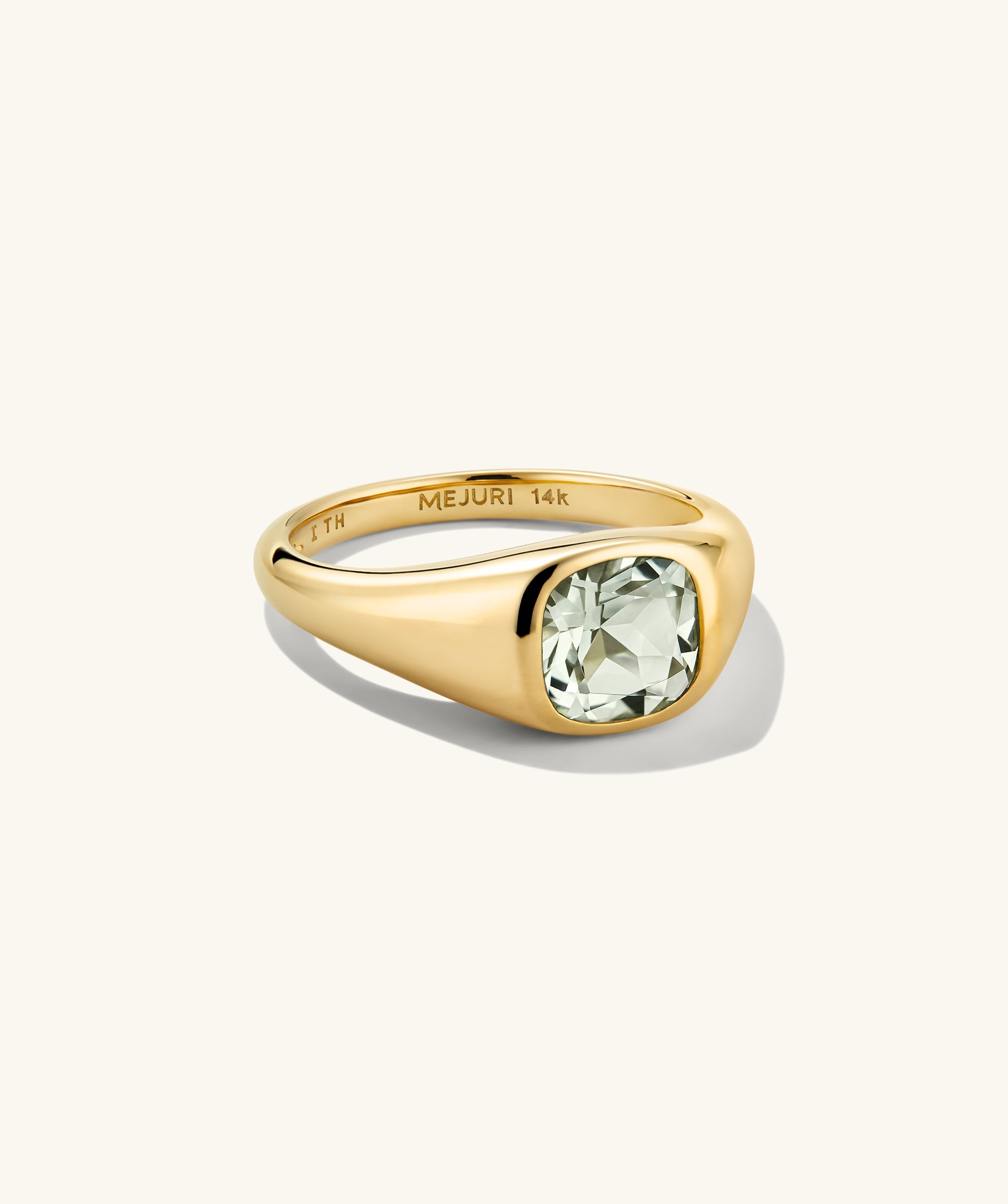Jude Pinky Signet Ring featuring a cushion-cut gemstone on a signet-style band, engraved with MEJURI 14k, displayed on a simple background.