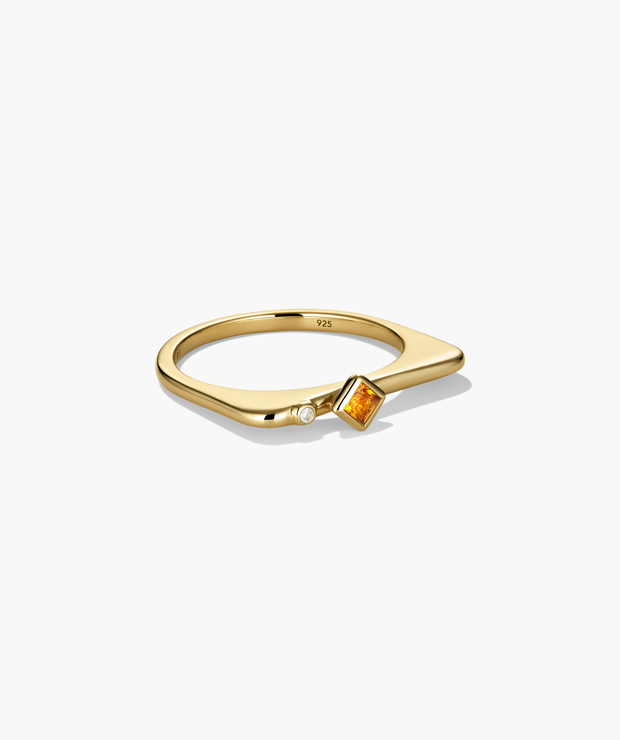 Puzzle Stacking Ring: Open-ended gold ring featuring a square-cut orange gemstone and a tiny round white stone at the tips, inviting creative stacking combinations.