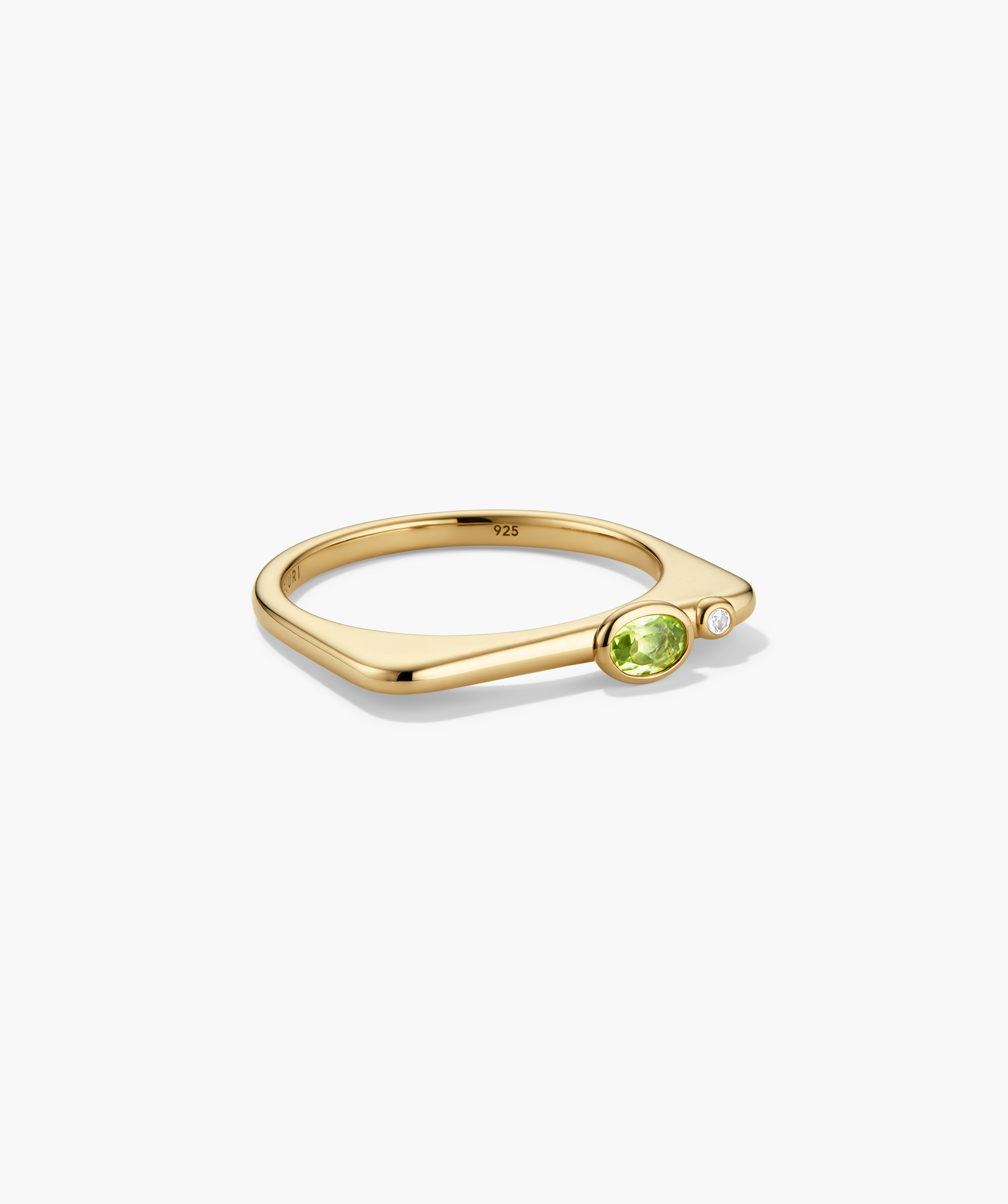 Puzzle Stacking Ring: Gold-plated sterling-silver ring with an angular design, featuring an oval green peridot and a small white accent stone.