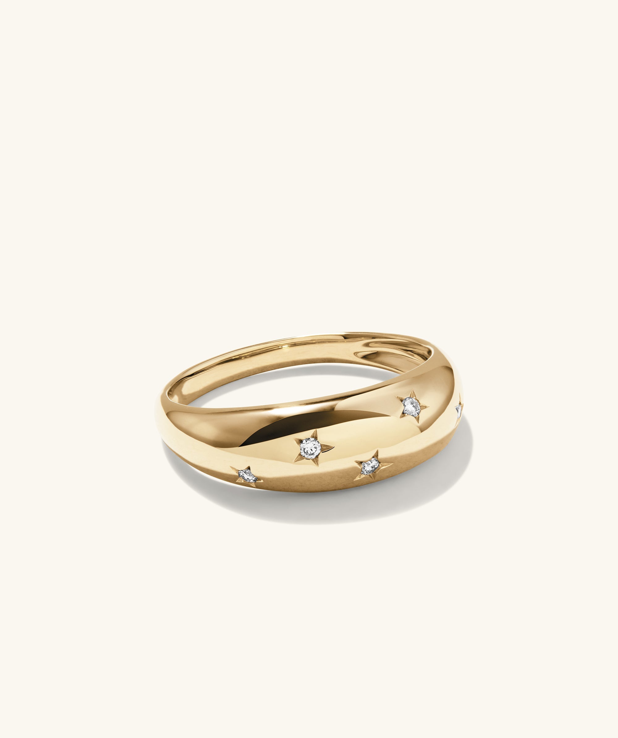 Celestial DÃ´me Ring: A gold ring adorned with diamond stars, exuding glamour and elegance, perfect as an engagement or fashion accessory.