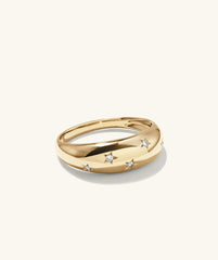 Celestial DÃ´me Ring: A gold ring adorned with diamond stars, exuding glamour and elegance, perfect as an engagement or fashion accessory.