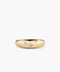 Celestial DÃ´me Ring featuring a polished gold band with star-engraved settings, each holding a small round diamond for added glamour.