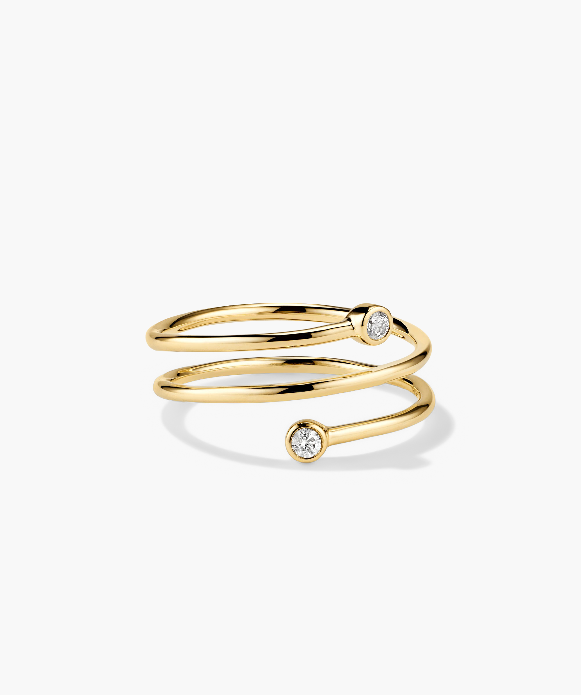 Diamond Coil Ring: Handcrafted 14k gold ring featuring responsibly sourced pavÃ© diamonds, designed to give the appearance of multiple rings in one.