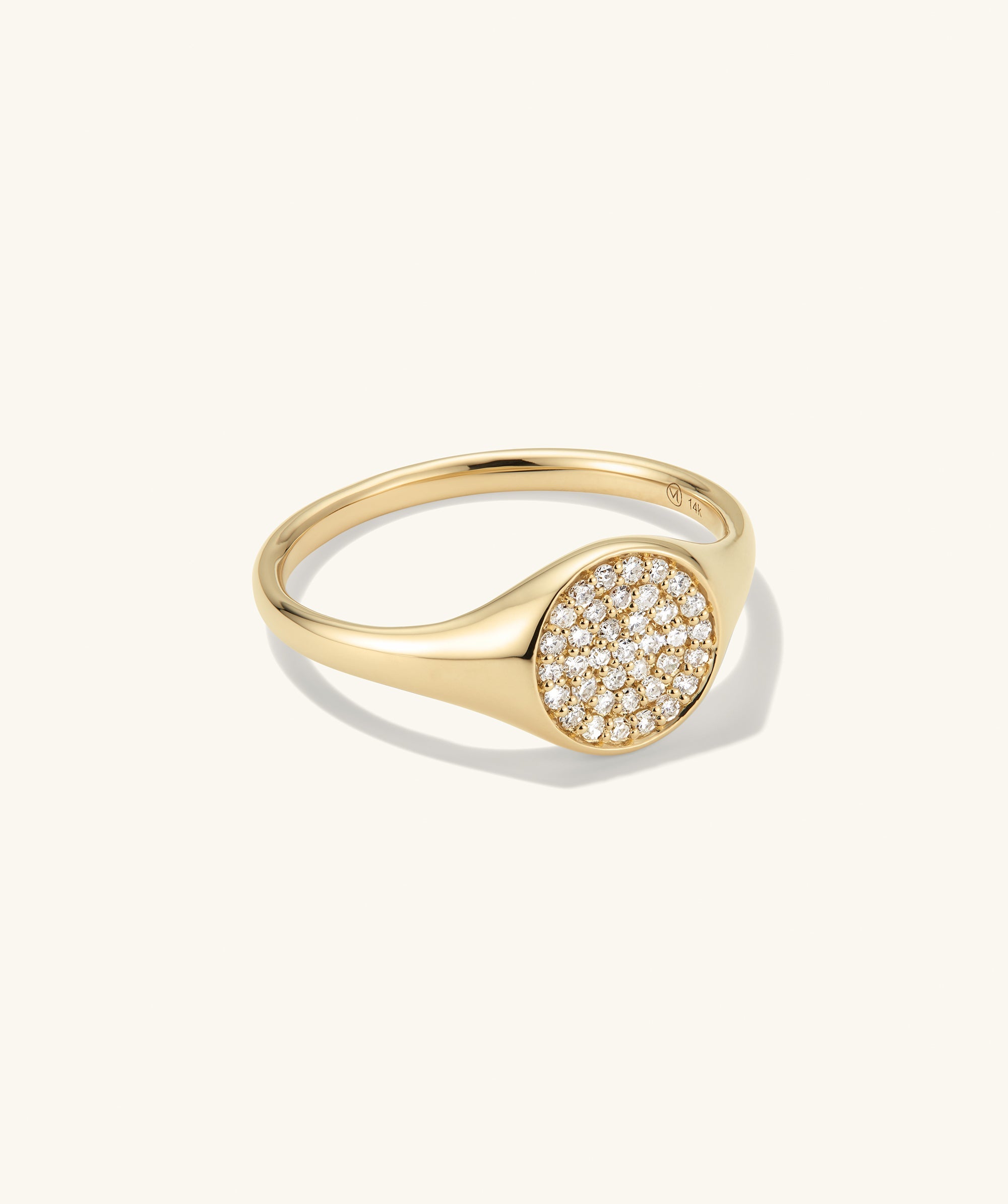 PavÃ© Diamond Signet Pinky Ring featuring a gold band adorned with sparkling diamonds, exemplifying elegance in a compact design.