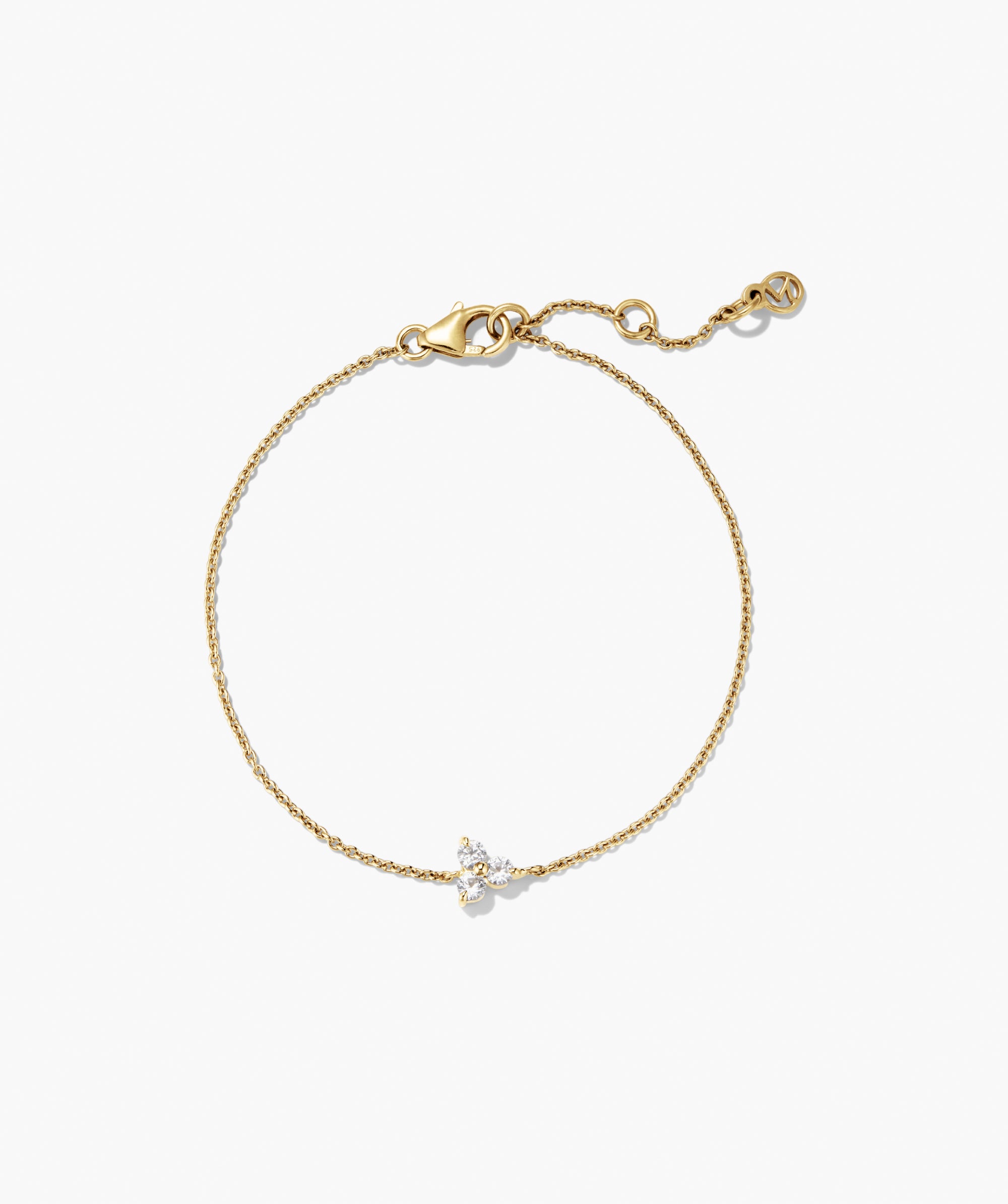 Lotus Bracelet featuring a yellow-gold chain with three clear stones at the center, lobster clasp, and extender chain, offering versatile elegance for any occasion.