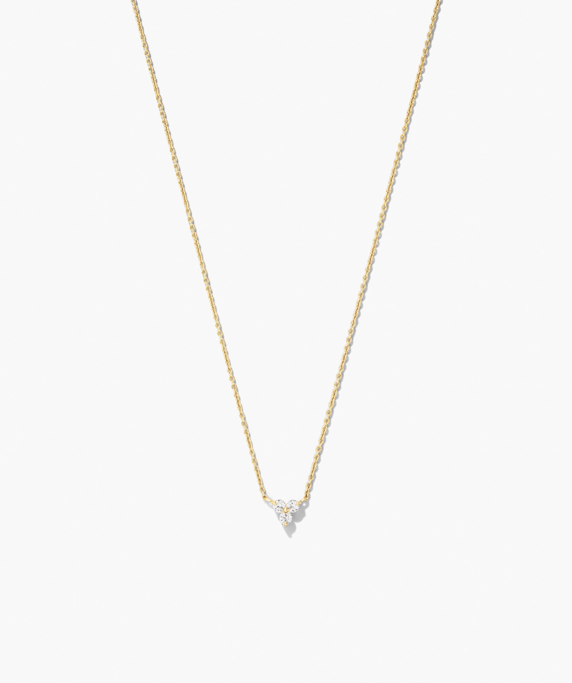 Lotus Necklace (Copy): A delicate yellow-gold chain featuring a small pendant with three sparkling stones in a triangular cluster for versatile elegance.