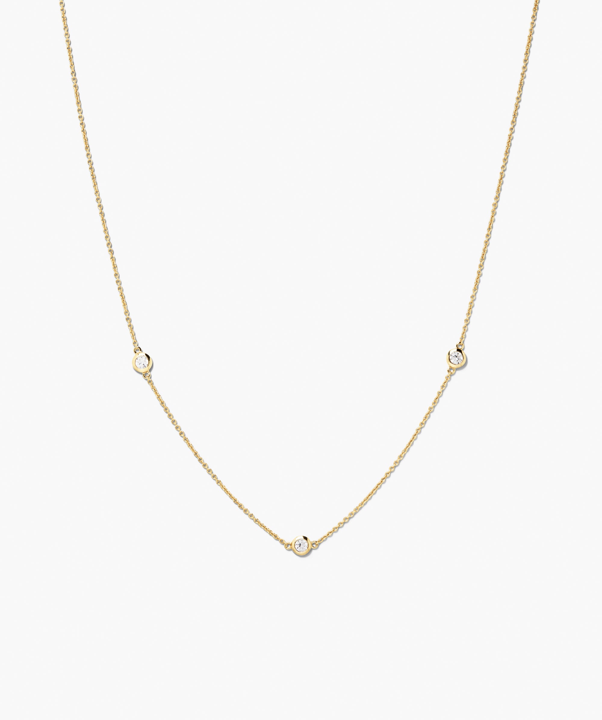 Satellite Necklace: A delicate vermeil chain with three bezel-set white sapphires, arranged for a minimalist, station-style look, perfect for any outfit.