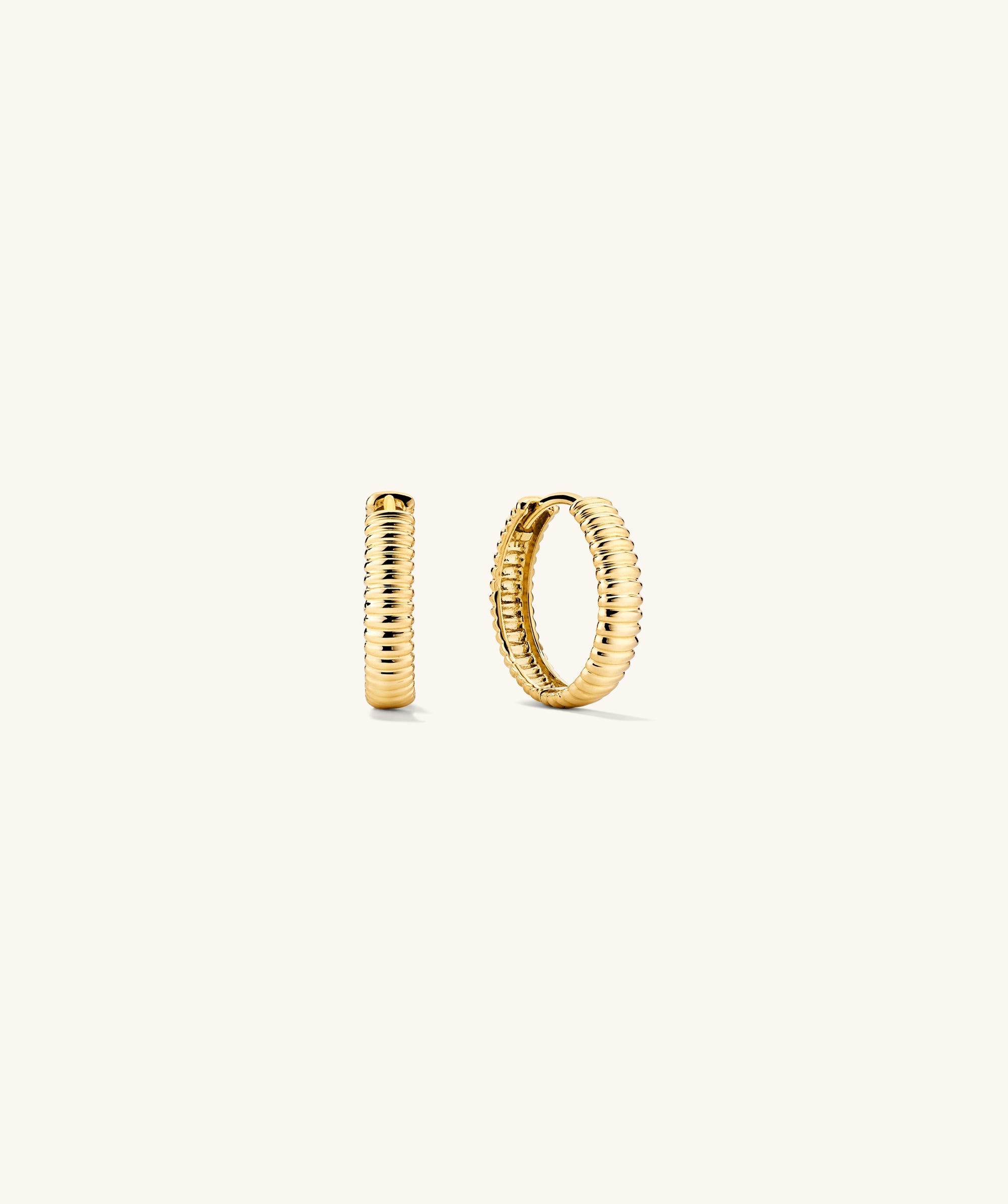 Bold Micro Charlotte Small Hoop Salmon Gold earrings with a distinct plissÃ© texture, handcrafted from nature-positive Salmon Gold, displayed against a simple background.