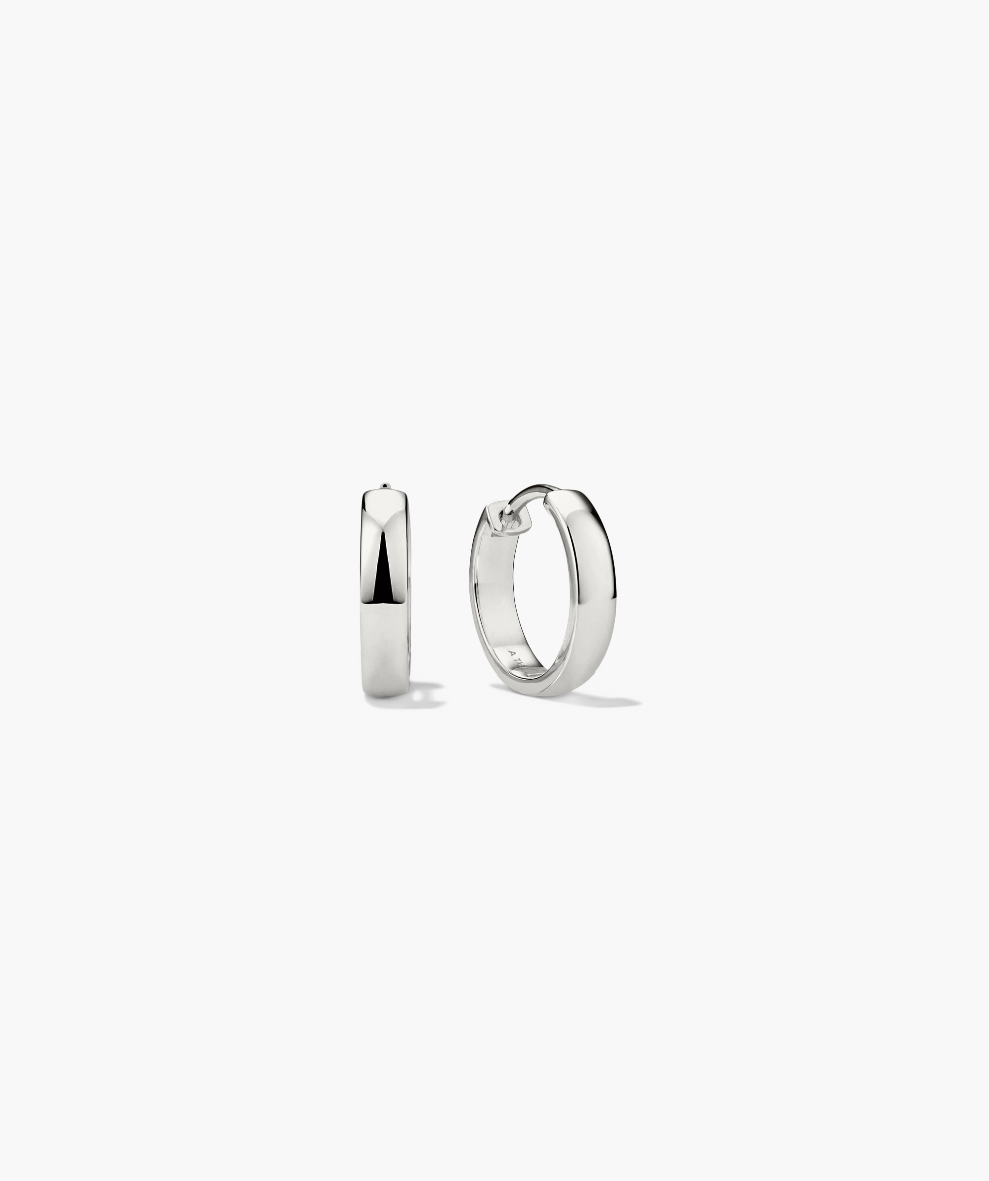A pair of Bold Small Hoops, silver hoop earrings designed to elevate outfits and boost moods.