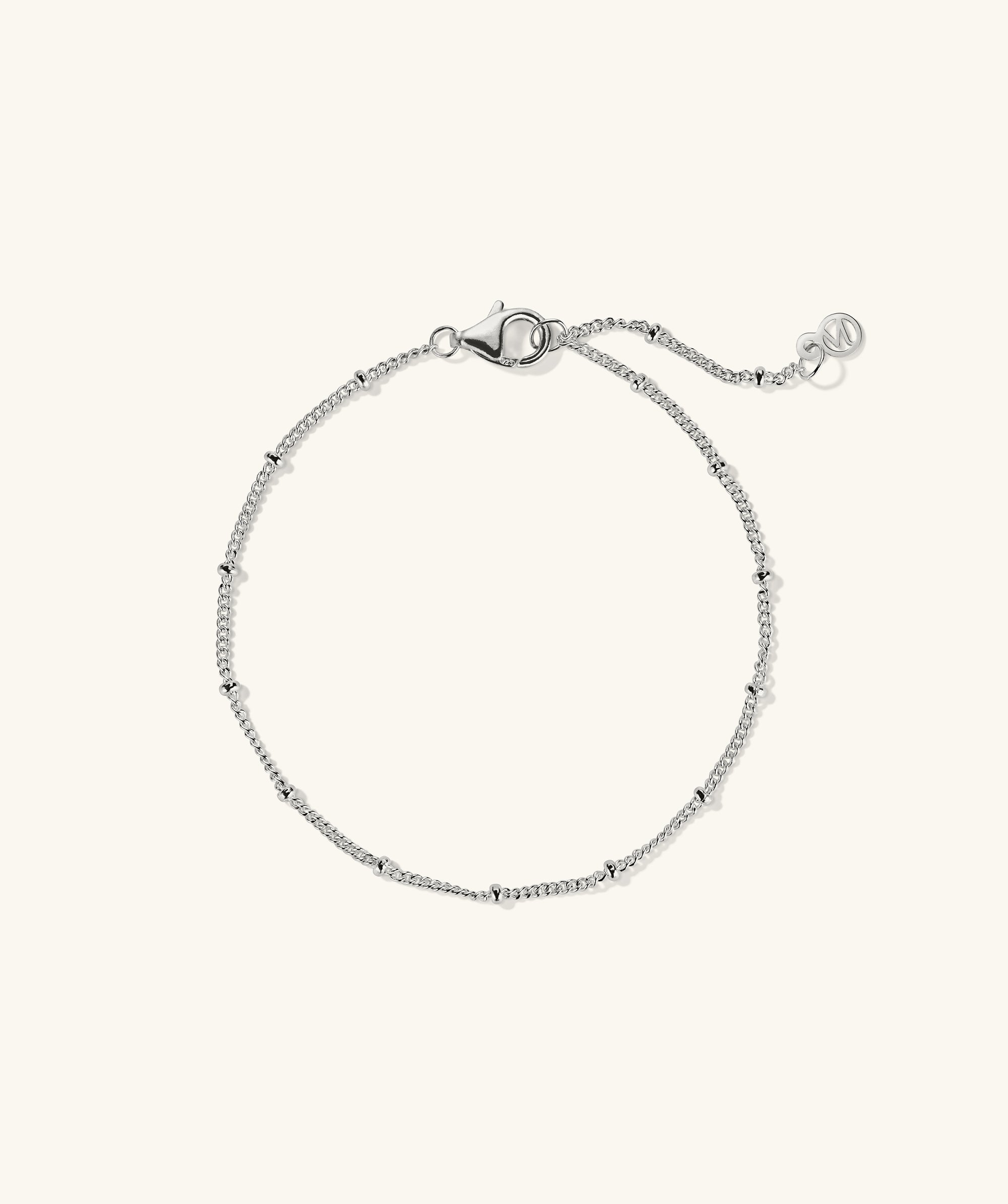 Spheres Chain Bracelet: A minimalistic silver chain bracelet with a clasp, perfect for any occasion, making a big statement with its simplicity.