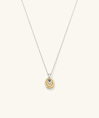 Jojo Loop Pendant Necklace featuring a gold pendant on a silver chain, highlighting its mixed metal design as a fashionable accessory.