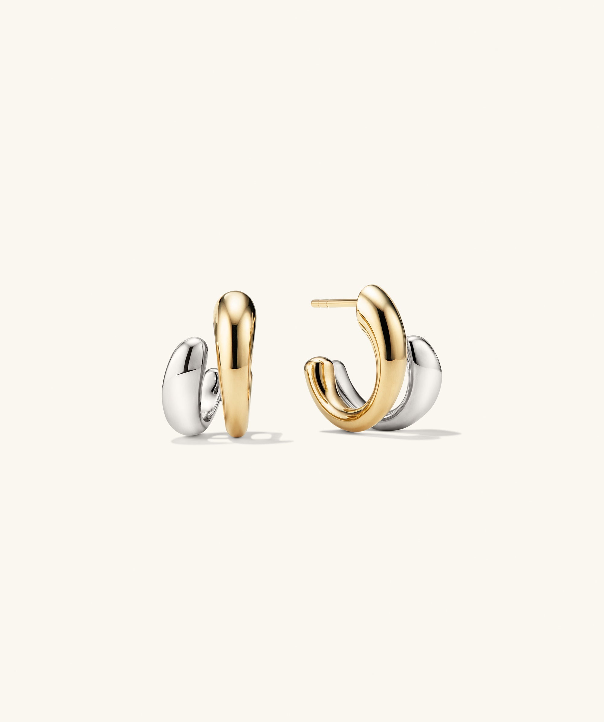 Jojo Double Hoops featuring a mixed metal design with an optical illusion effect, showcasing a unique twist on classic hoop earrings.