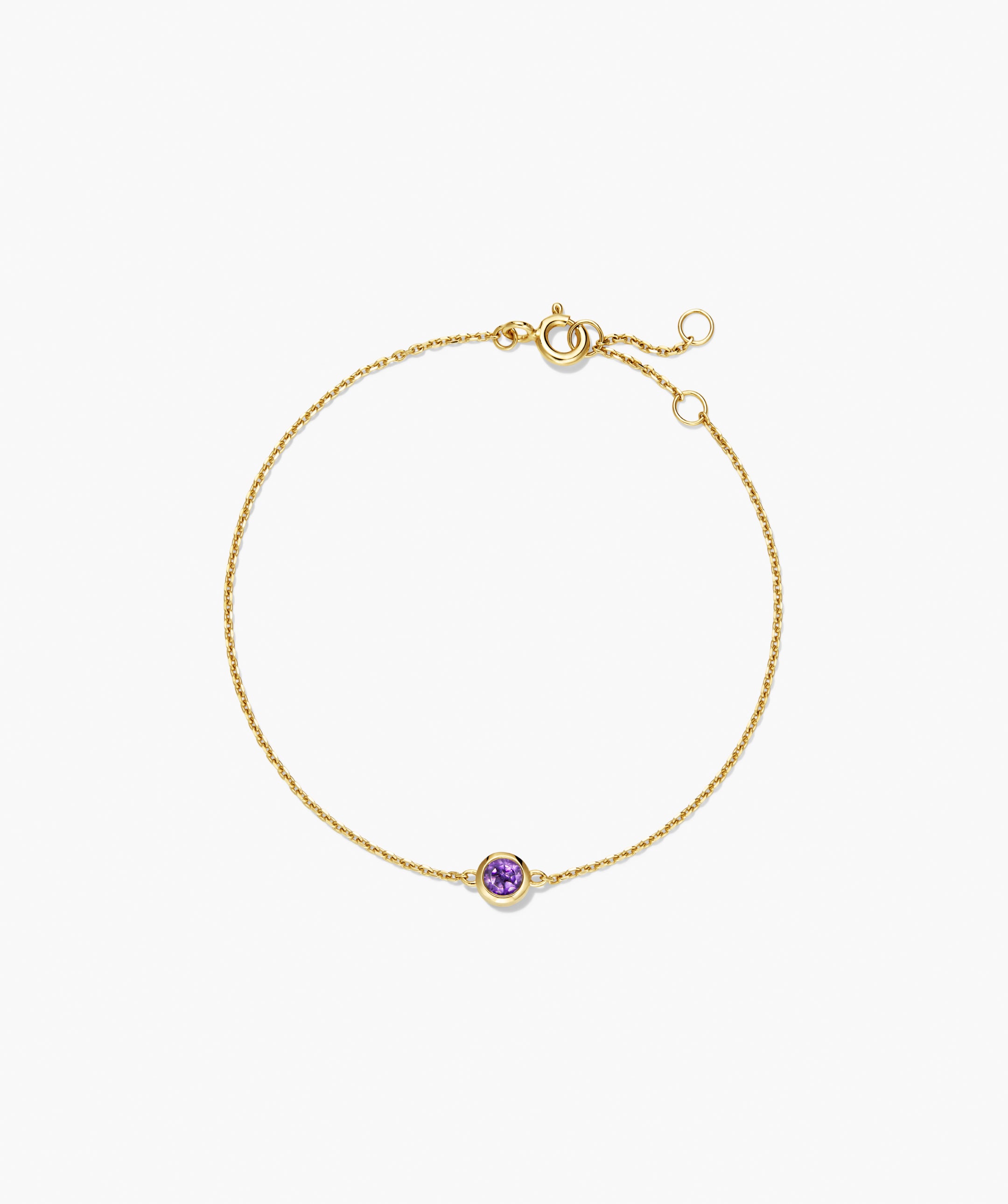 Sia Birthstone Bracelet features a delicate gold chain with a bezel-set purple gemstone and adjustable extender, ideal for personalized gifting.