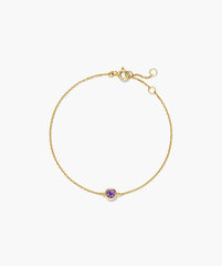 Sia Birthstone Bracelet features a delicate gold chain with a bezel-set purple gemstone and adjustable extender, ideal for personalized gifting.
