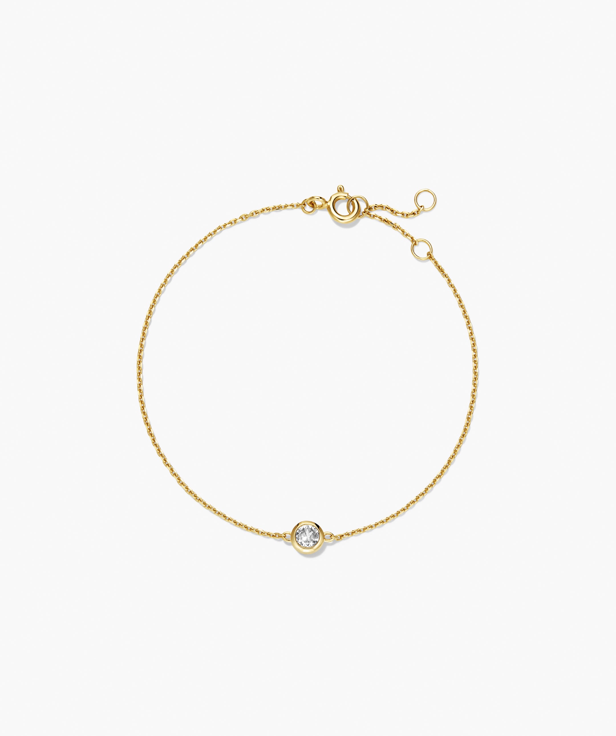 Sia Birthstone Bracelet: Delicate gold chain with a bezel-set diamond centerpiece, featuring a spring-ring clasp and adjustable jump rings, perfect for personalized gifting.