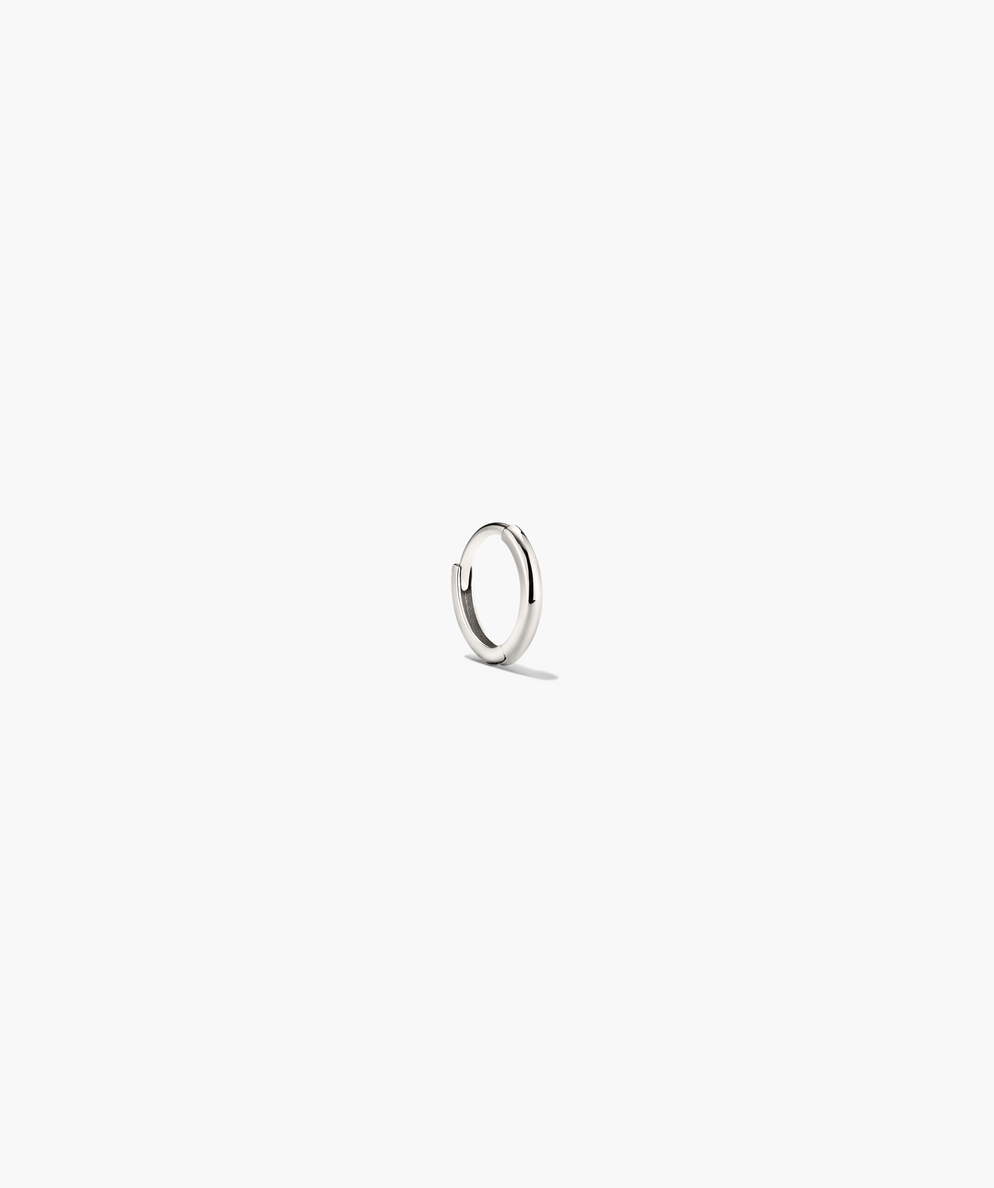 Mini Hoop: A lightweight silver ring with a hinge clasp, designed for daily wear. Ideal for minimalistic style, sold individually.