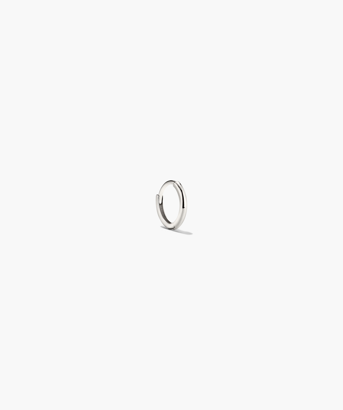 Mini Hoop: A lightweight silver ring with a hinge clasp, designed for daily wear. Ideal for minimalistic style, sold individually.