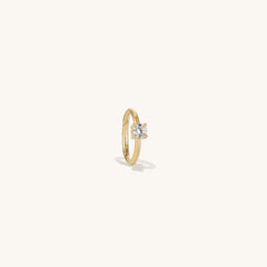 Cartilage Solo Diamond Mini Hoop: a close-up of a 14k solid gold hoop with a hinge clasp, set with a single responsibly sourced diamond, designed for helix wear.