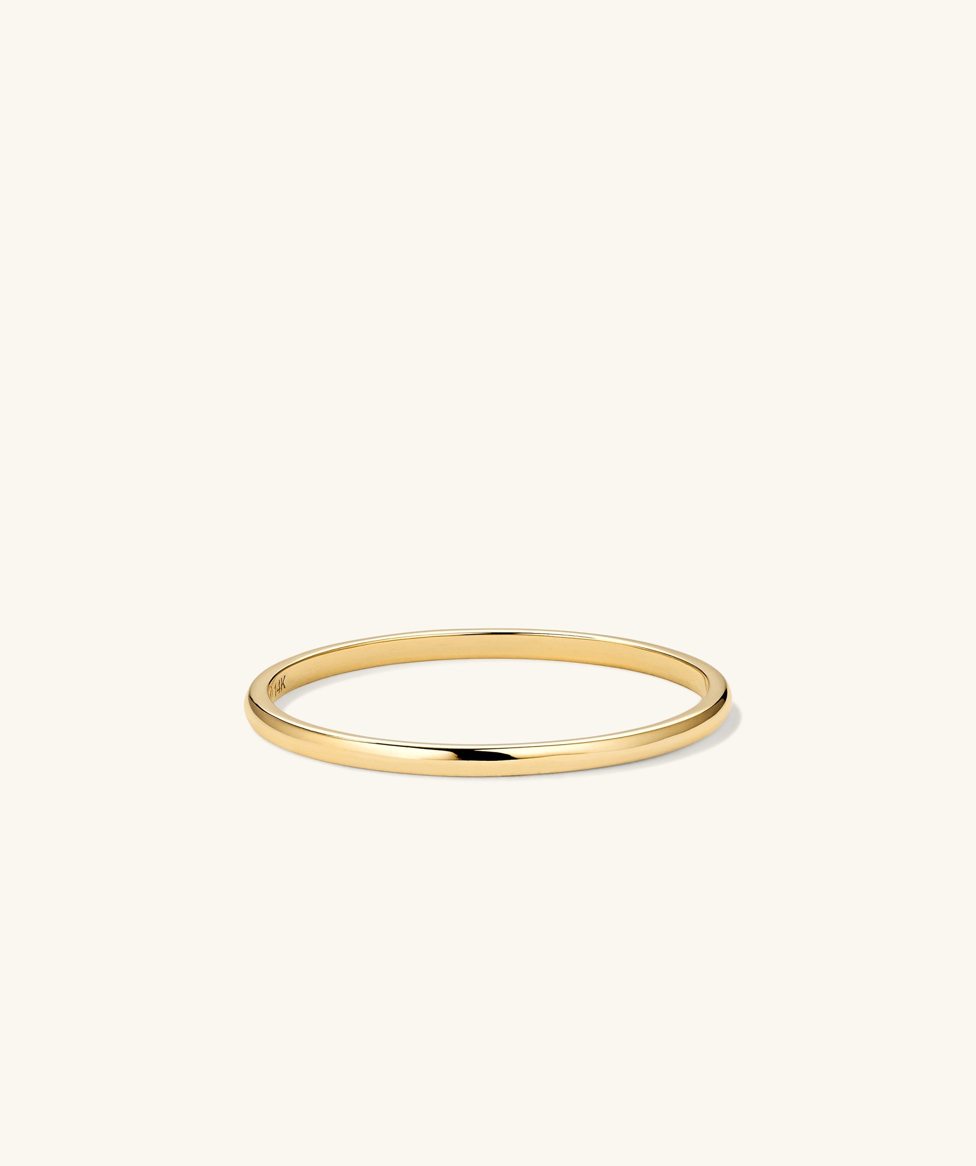 Stacker Ring: A sleek, minimalist gold ring, ideal for daily wear and versatile styling. Perfect as a starter piece or addition to any collection.
