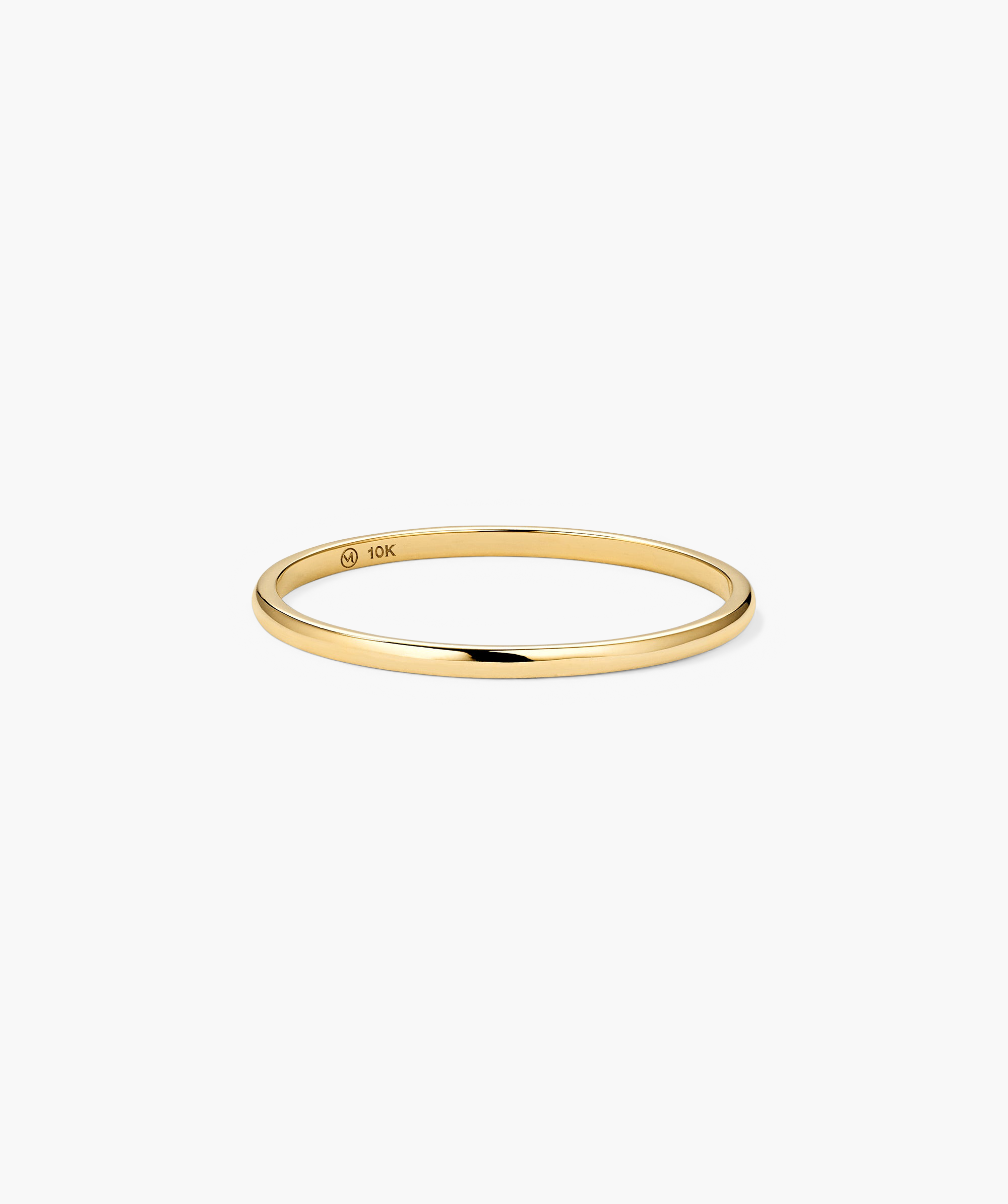 Stacker Ring: A slender 10-karat yellow-gold bangle with a 10K purity stamp, ideal for stacking or as a versatile starter piece.