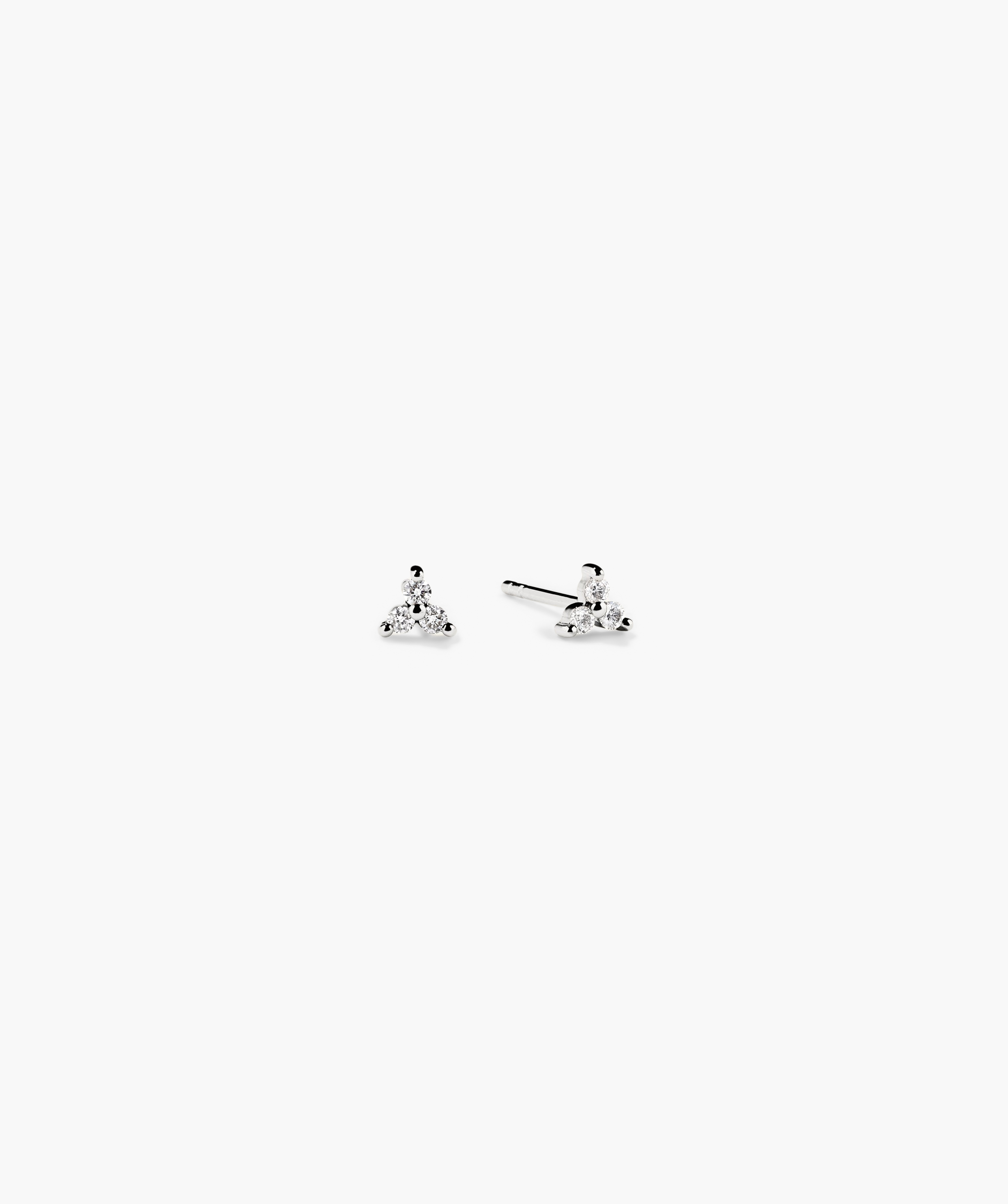 Mini Lotus Diamond Studs: Lotus-shaped diamond earrings in 14k solid gold, perfect for stacking or completing a look. Handcrafted with responsibly sourced diamonds.