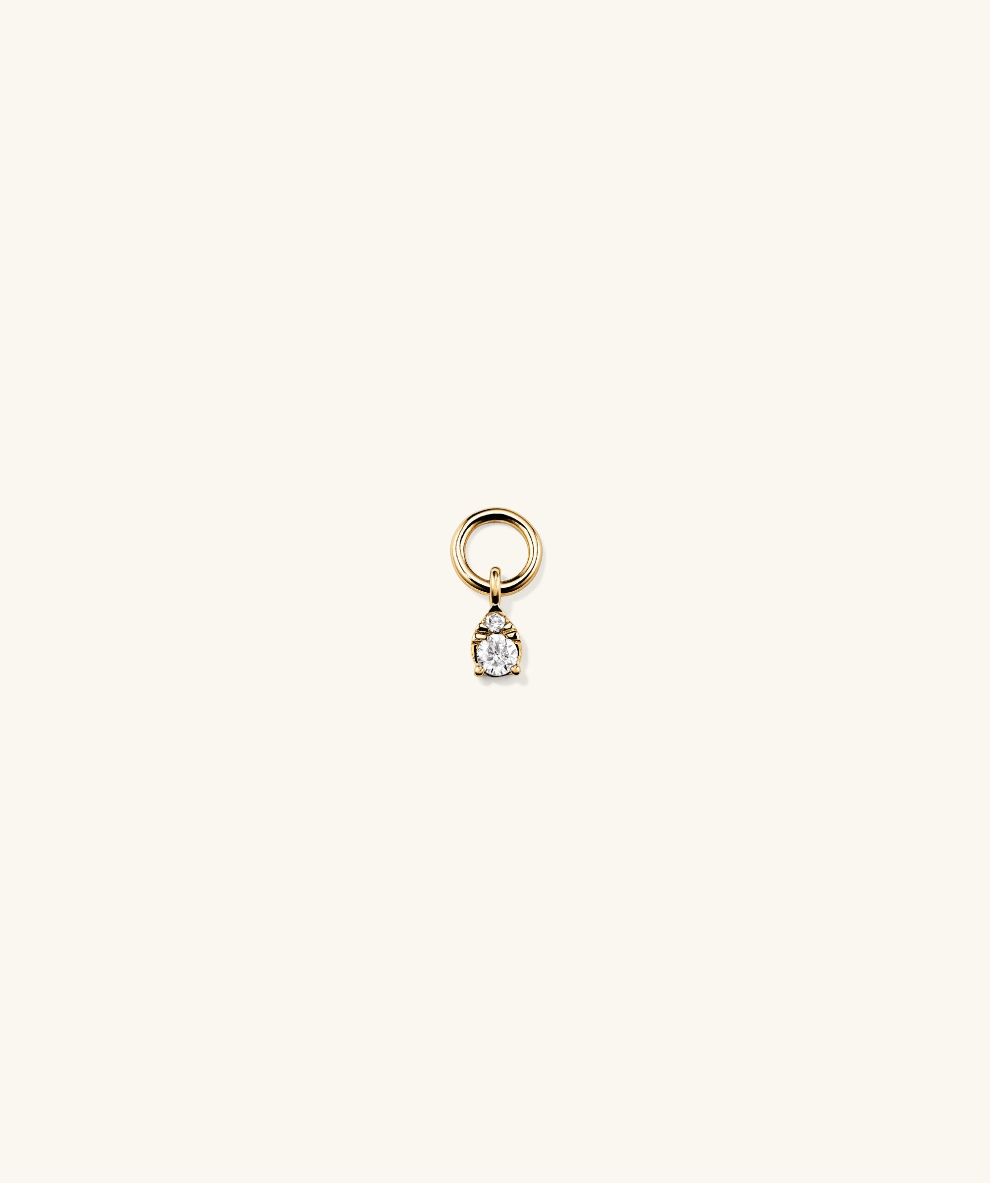 Mini Pear Diamond Hoop Charm: Close-up of a handcrafted 14k solid gold ring with a pear-shaped, responsibly sourced diamond, perfect for stacking.