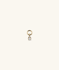 Mini Pear Diamond Hoop Charm: Close-up of a handcrafted 14k solid gold ring with a pear-shaped, responsibly sourced diamond, perfect for stacking.