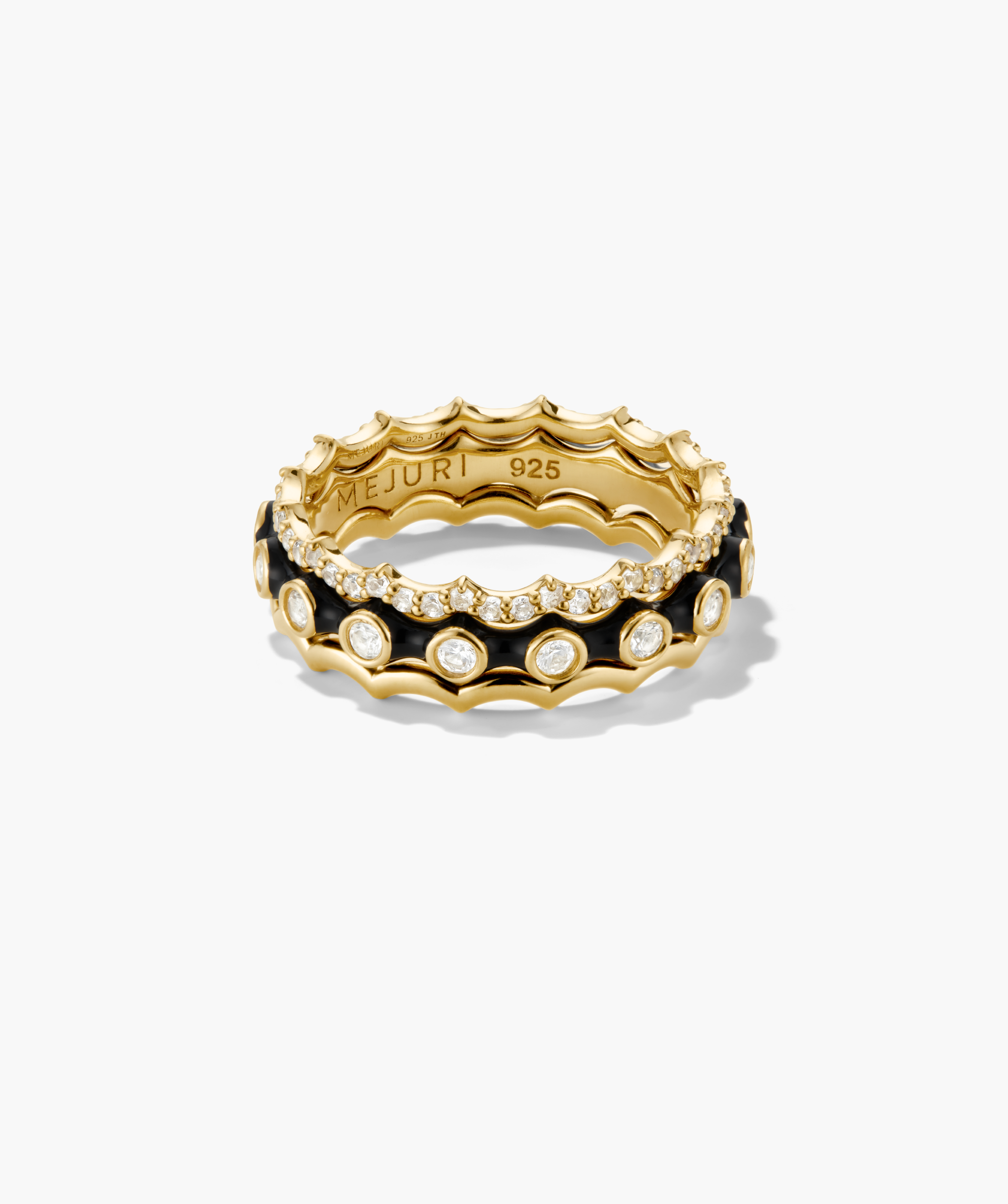 Gemstone Charlotte Stacker Bundle featuring two gold-tone rings: one with scalloped pave stones, the other with black enamel circles and bezel-set stones.
