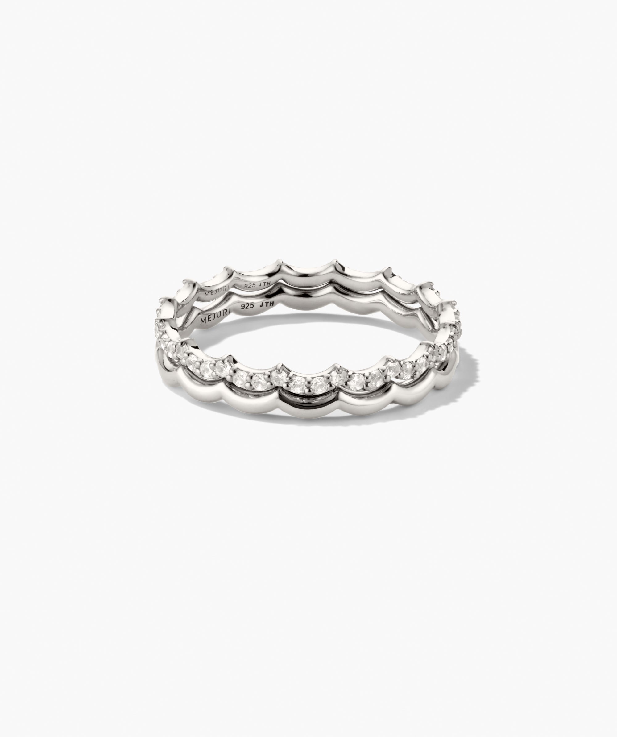Slim Charlotte Stacker Set: Close-up of polished sterling silver bands, one with pavÃ©-set diamonds along scalloped edges, perfect for adding elegance to any stack.