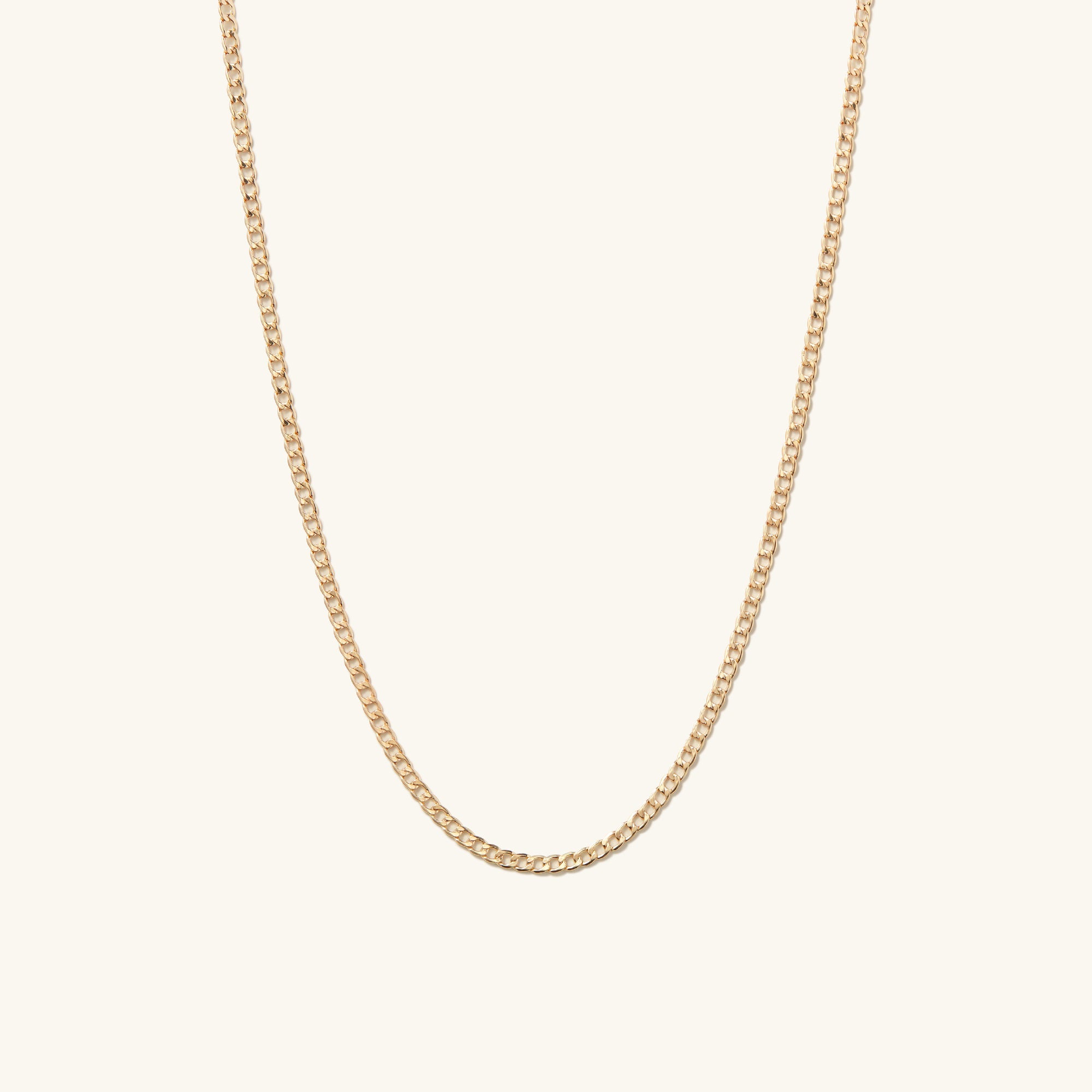 Flat Curb Chain Necklace: A sleek gold chain with a minimalist design, perfect for everyday wear and elevating any outfit.