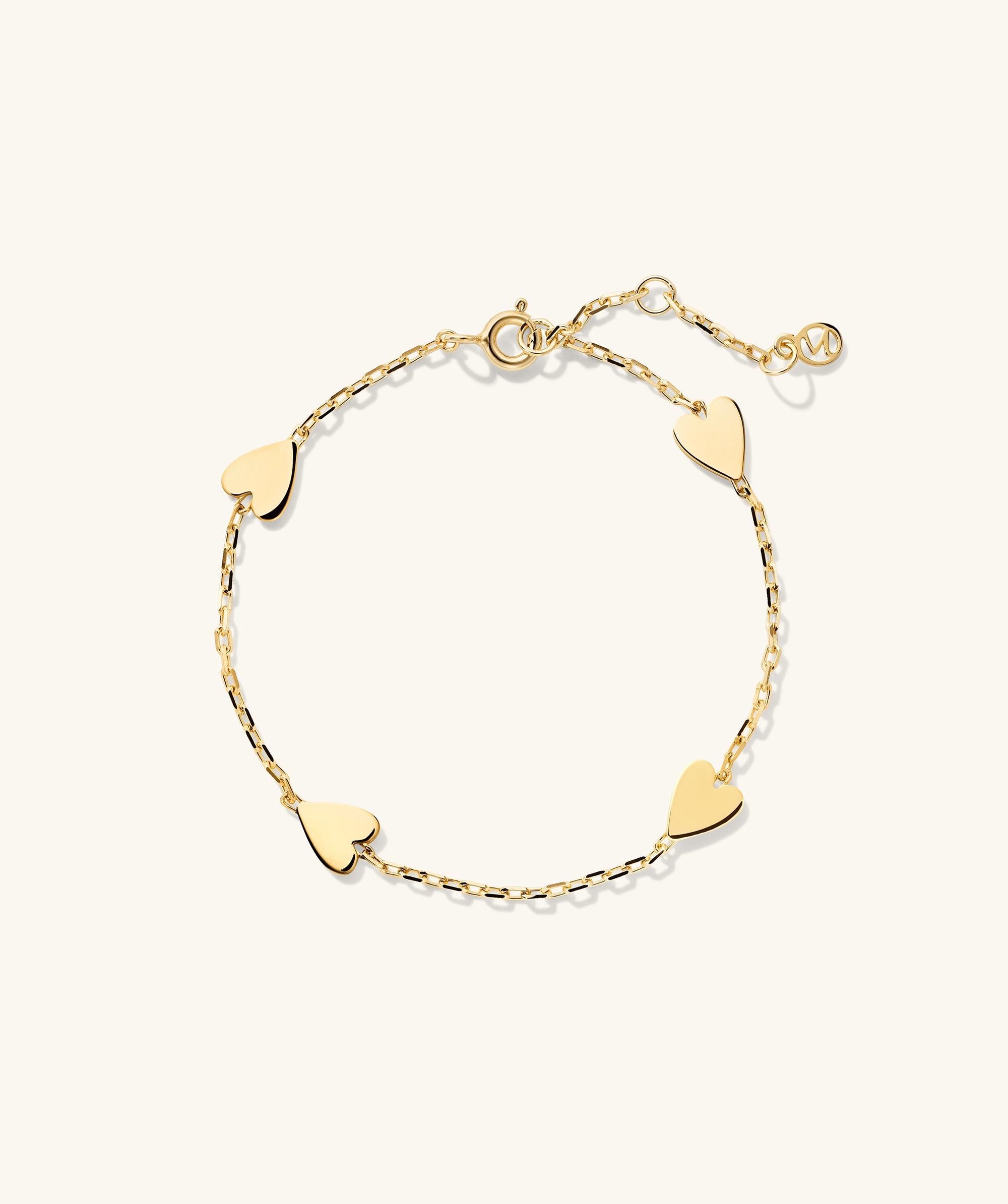 Heart Station Bracelet featuring gold hearts linked together, creating a delicate and stylish fashion accessory perfect for any occasion.