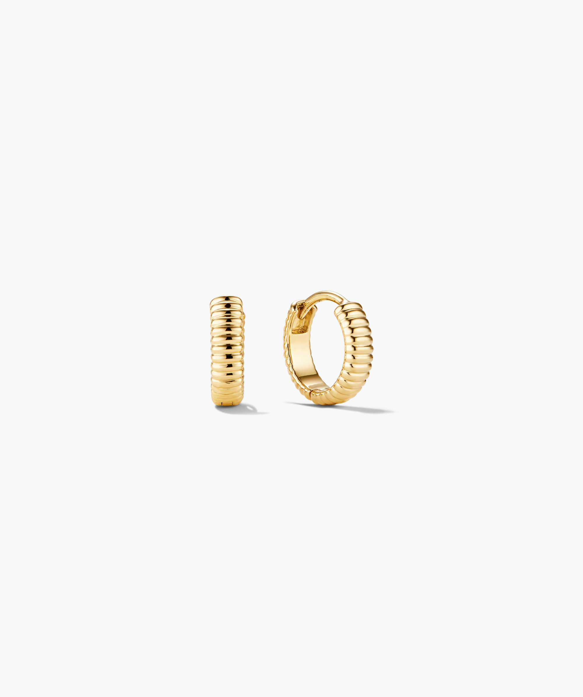 Charlotte Textured Huggie Hoops; small, ribbed gold earrings with a polished finish, one closed, the other open, showcasing a hinged design.