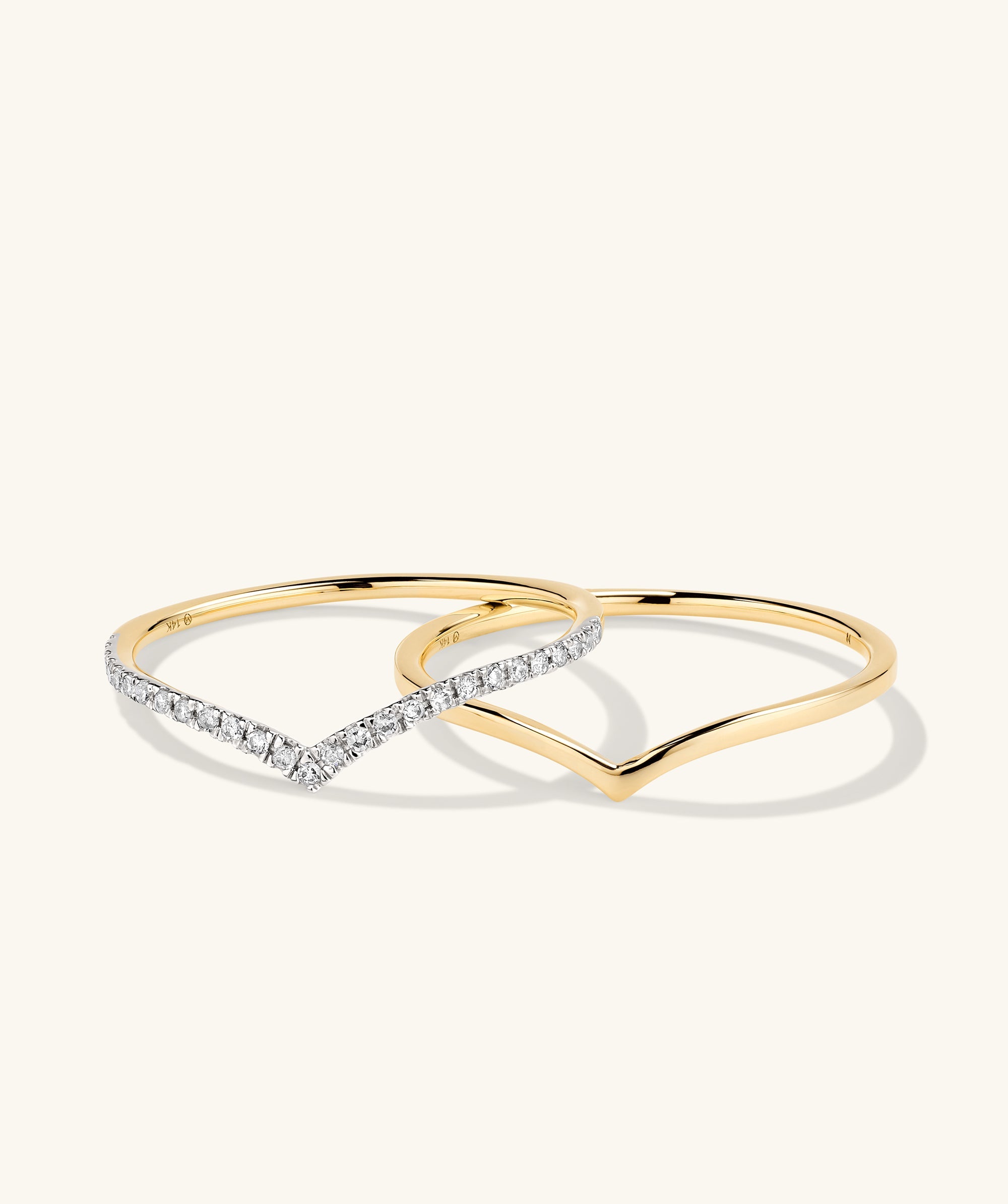 Wishbone Stacker Set featuring intertwined gold and silver rings, showcasing elegant fashion accessory design with a focus on jewelry craftsmanship.